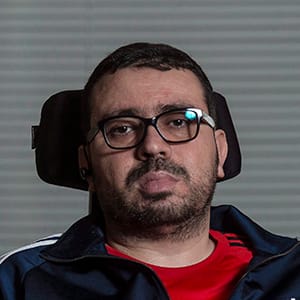 Aymen Derbali poses for a photo in Quebec City on Wednesday, December 27, 2017. A fundraiser to find a new home for a man who lost use of his legs in the Quebec City mosque shooting earlier this year has reached almost half its goal. Aymen Derbali, a father of three, was one of the more than 50 people inside the mosque when a shooter opened fire last Jan. 29, killing six. He took seven bullets and was paralyzed from the waist down. The objective is to raise the $400,000 before the first anniversary of the shooting. THE CANADIAN PRESS/Francis Vachon