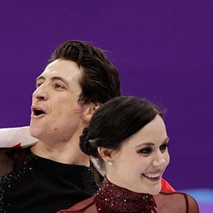 Tessa Virtue and Scott Moir of Canada celebrate during the venue ceremony after winning the gold medal in the ice dance, free dance figure skating final in the Gangneung Ice Arena at the 2018 Winter Olympics in Gangneung, South Korea, Tuesday, Feb. 20, 2018. (AP Photo/David J. Phillip)