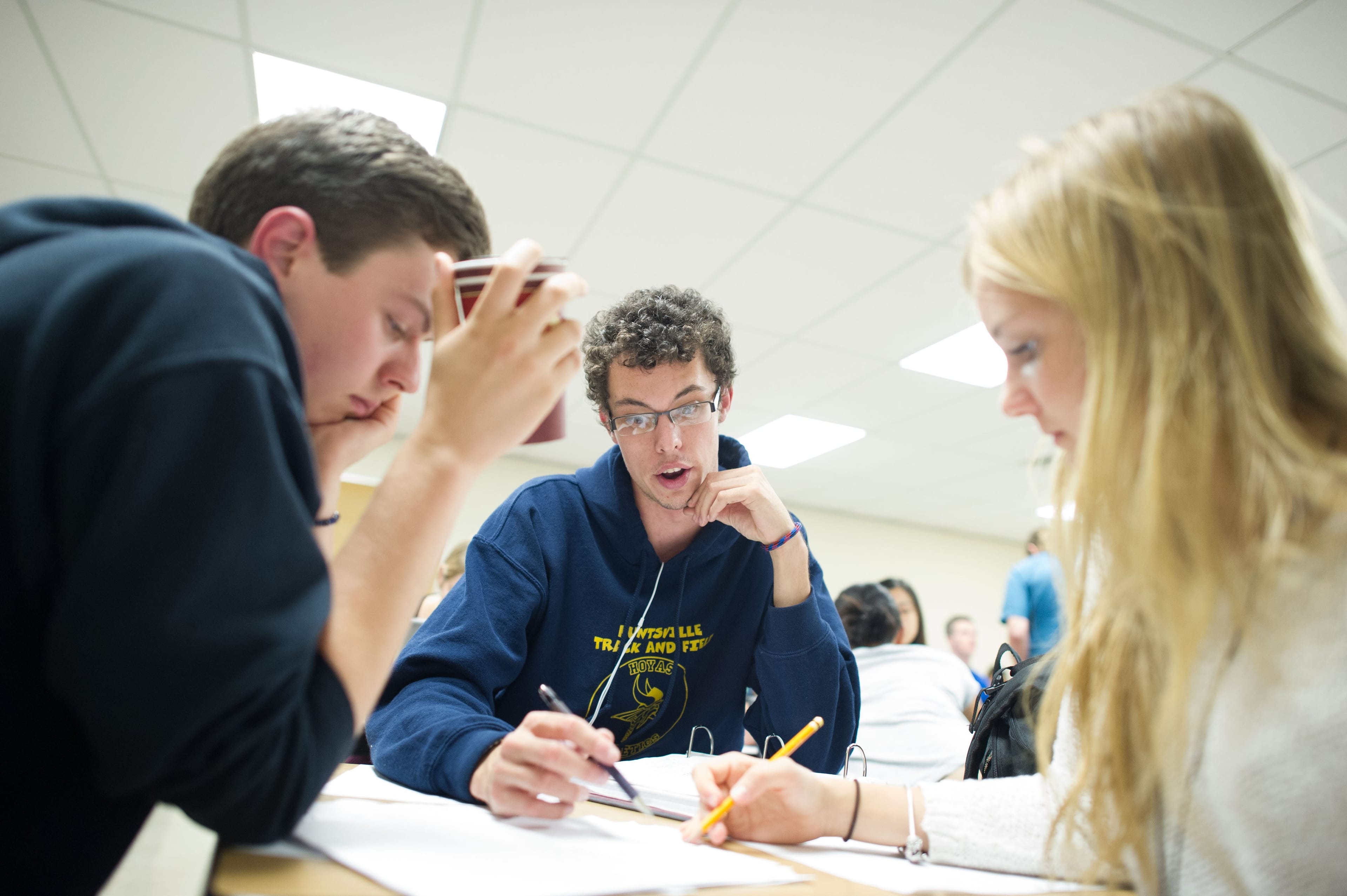 First-year mathematics and statistics students attend a lab led by Professor Peter Taylor in Geoffrey Hall on campus at Queens University in Kingston, ON. The lab promotes interaction between professor and student enabling a hands on approach that is lost during populous lectures in large rooms. (Photograph by Coel Garside)