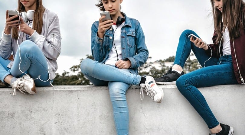 Teenage girls texting