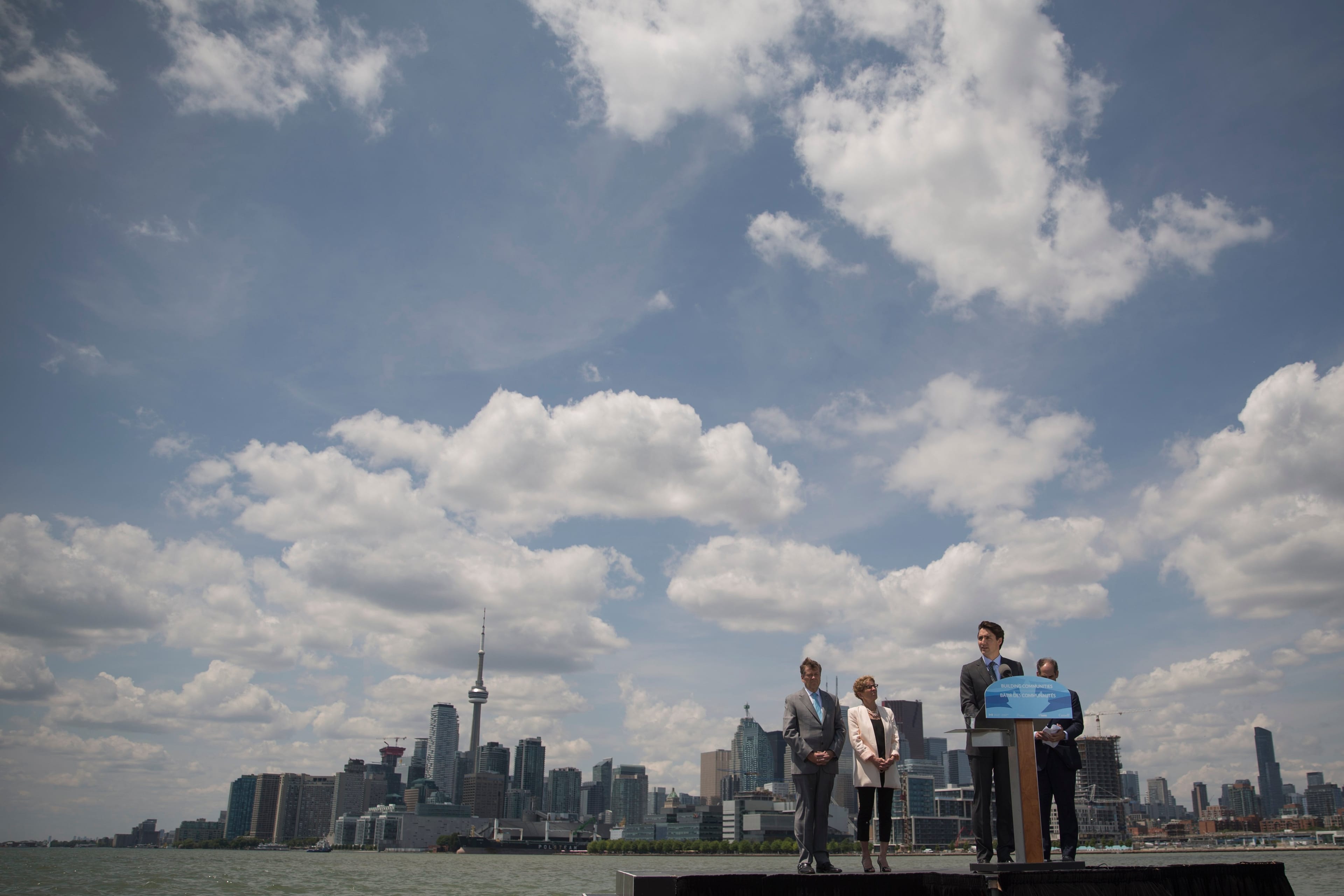 TORONTO, ON - JUNE 28: PM Justin Trudeau speaks as Toronto Mayor John Tory, Ontario Premier Kathleen Wynne and Waterfront Toronto CEO Will Fleissig listen on. All were on hand for the announcement of the development of the port lands in the city's west end waterfront. (Rick Madonik/Toronto Star via Getty Images)