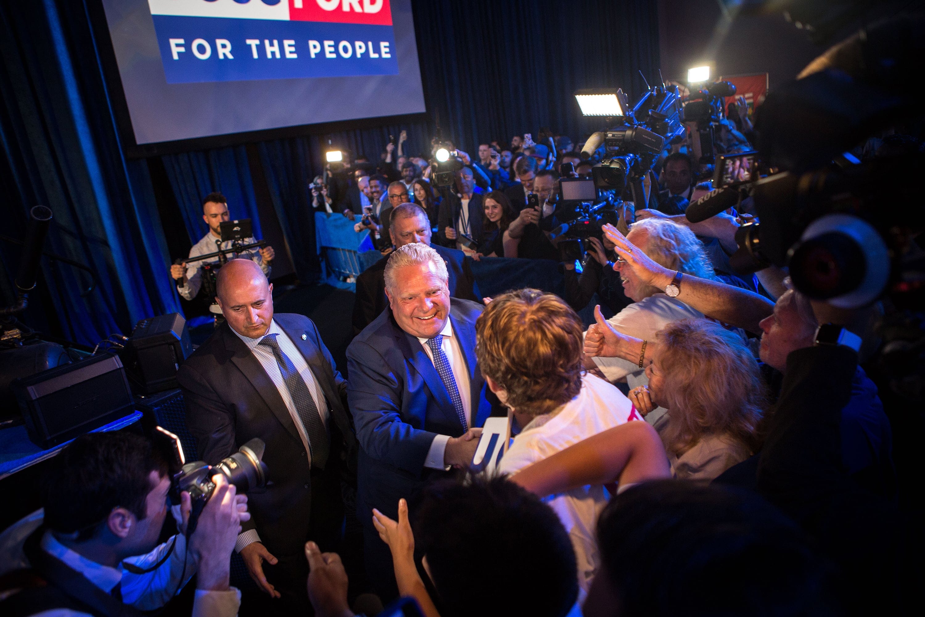 Ontario Premier Designate Doug Ford shakes hands with his supporters after his speech at the PC headquaters in Etobicoke, Ontario (Photograph by Chris Donovan)