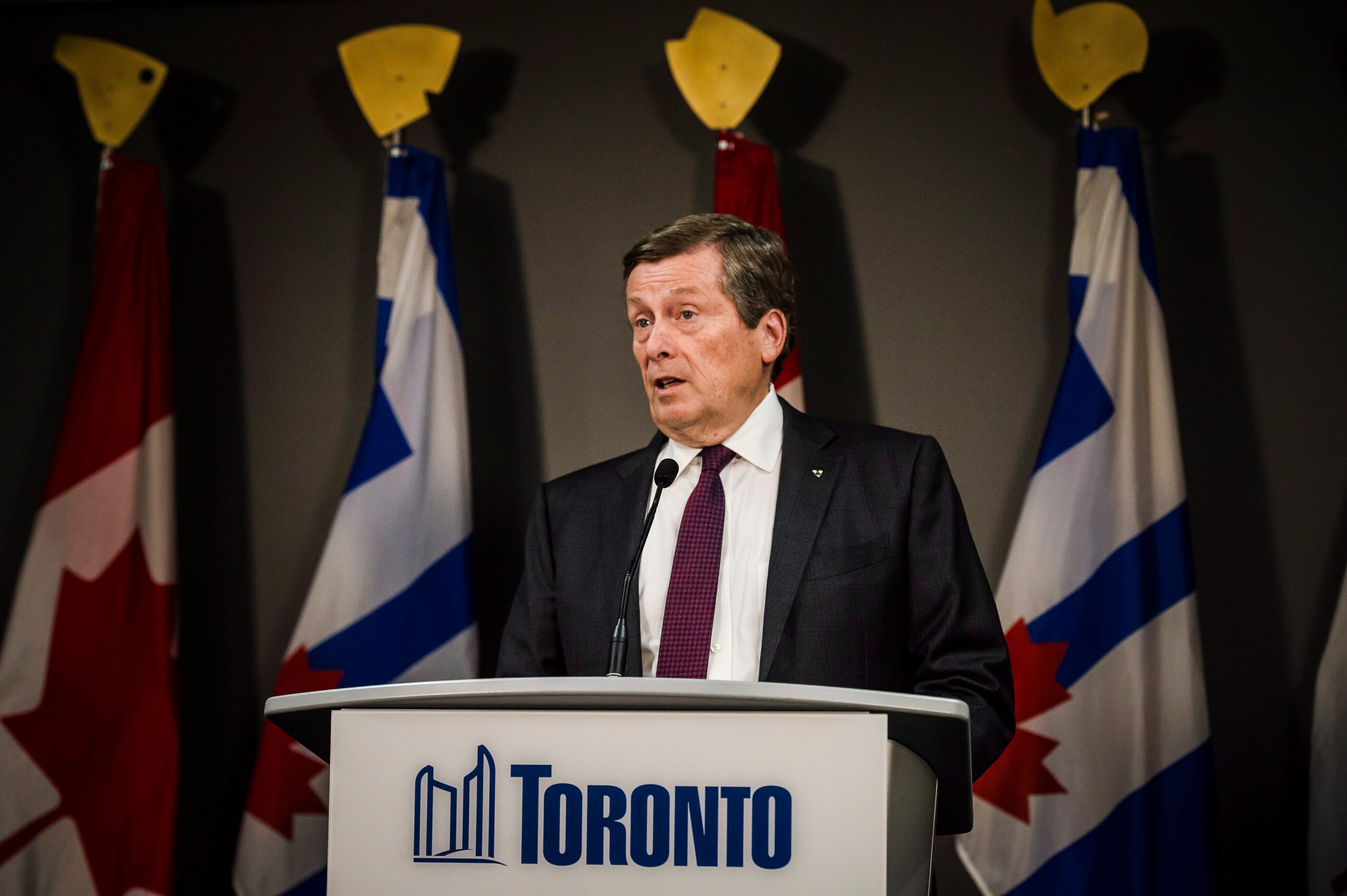 Toronto Mayor John Tory speaks to the media at Toronto city hall on Friday, July 27, 2018. Tory says he's told Ontario Premier Doug Ford that the process around a plan to slash the number of city councillors in half is "absolutely not right." THE CANADIAN PRESS/Christopher Katsarov