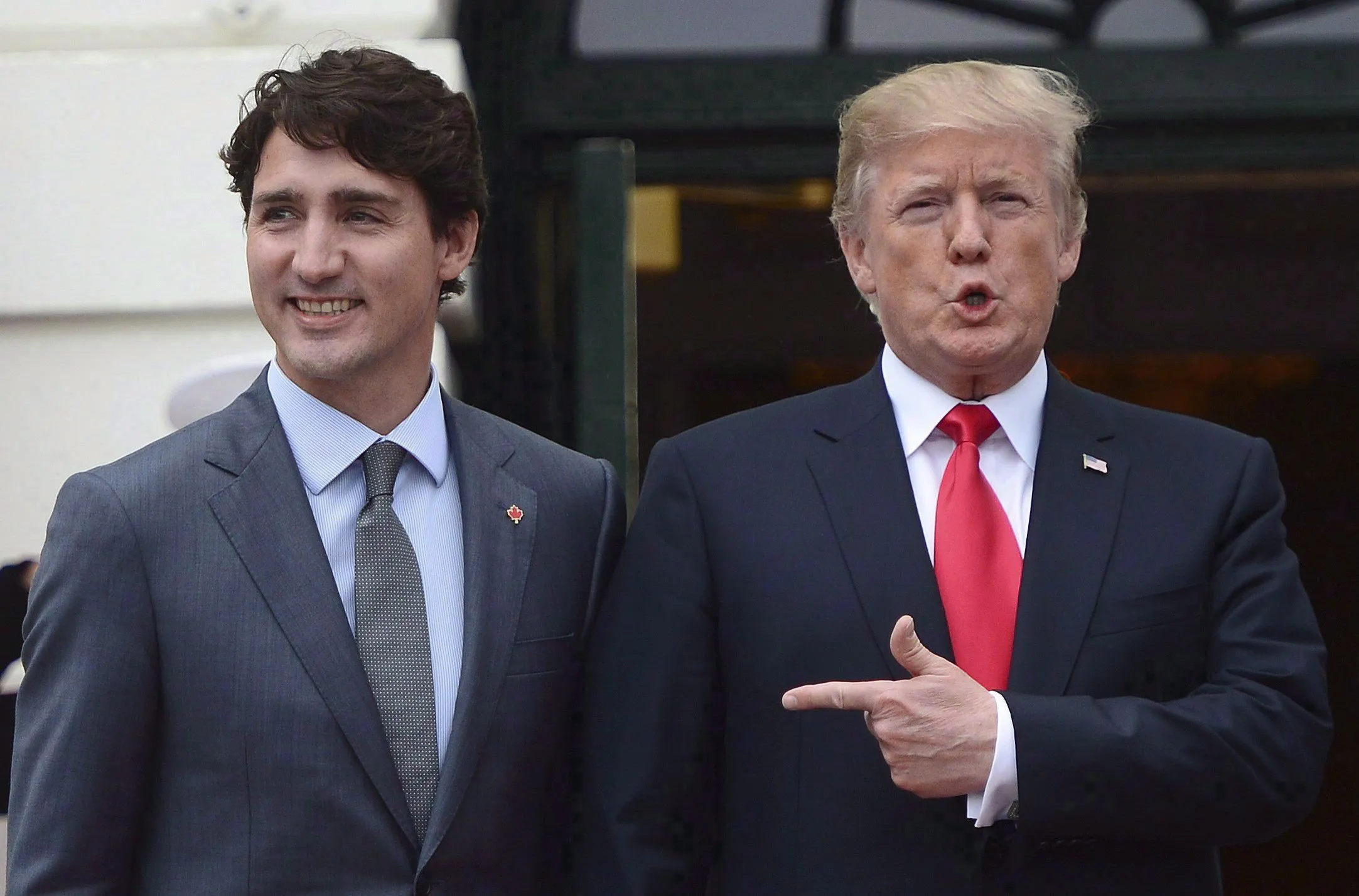 Prime Minister Justin Trudeau is greeted by U.S. President Donald Trump as he arrives at the White House in Washington, D.C., on Oct. 11, 2017. (THE CANADIAN PRESS/Sean Kilpatrick)