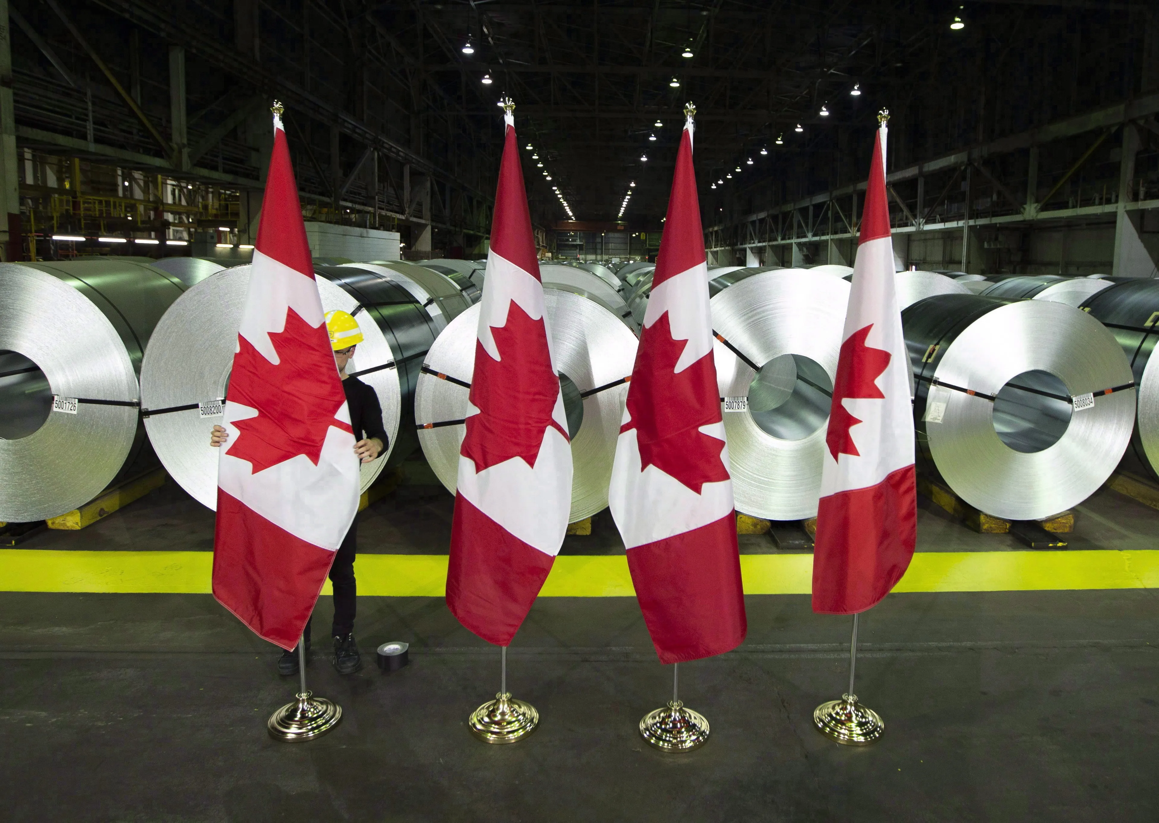Rolls of coated steel at Stelco in Hamilton, Ont. before a recent visit by Foreign Minister Chrystia Freeland; the new deal does not remove the U.S.'s 25 per cent duties on Canadian steel (THE CANADIAN PRESS/Peter Power)