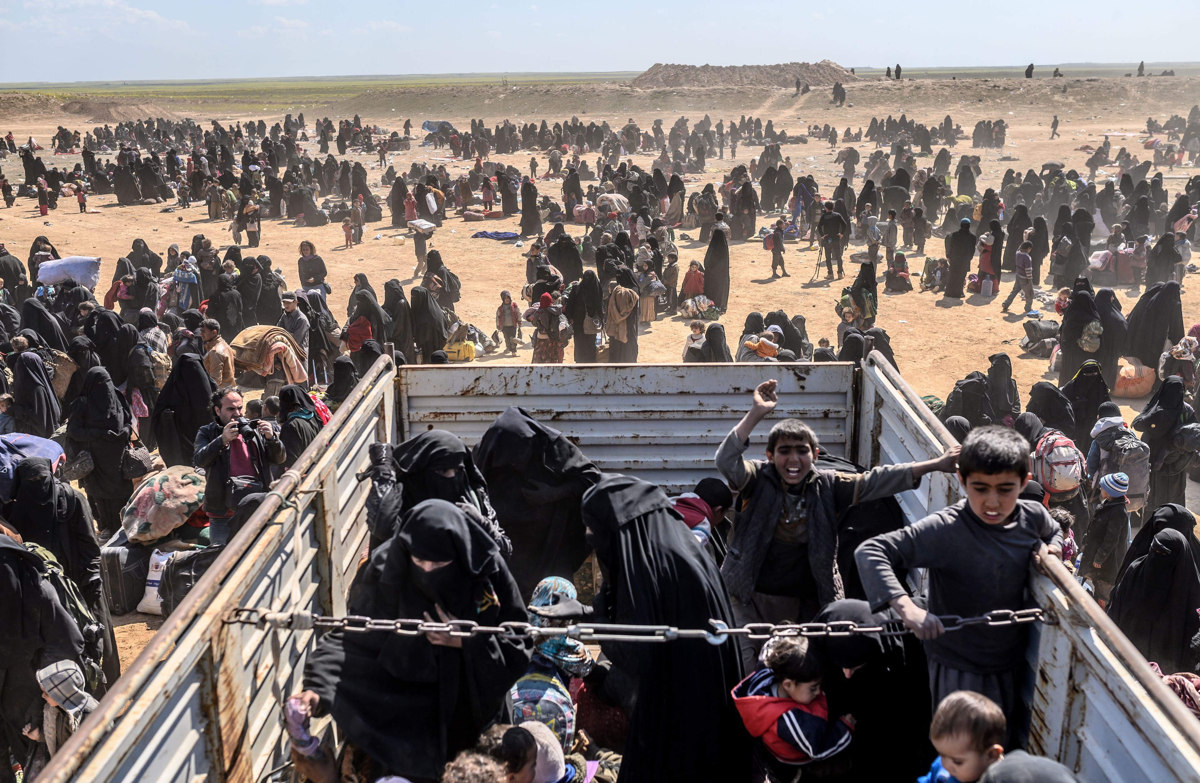 Women and children evacuated from the ISIS holdout of Baghouz arrive at a screening area held by the U.S.-backed SDF, in the eastern Syrian province of Deir Ezzor, on March 6, 2019. (BULENT KILIC/AFP/Getty Images)