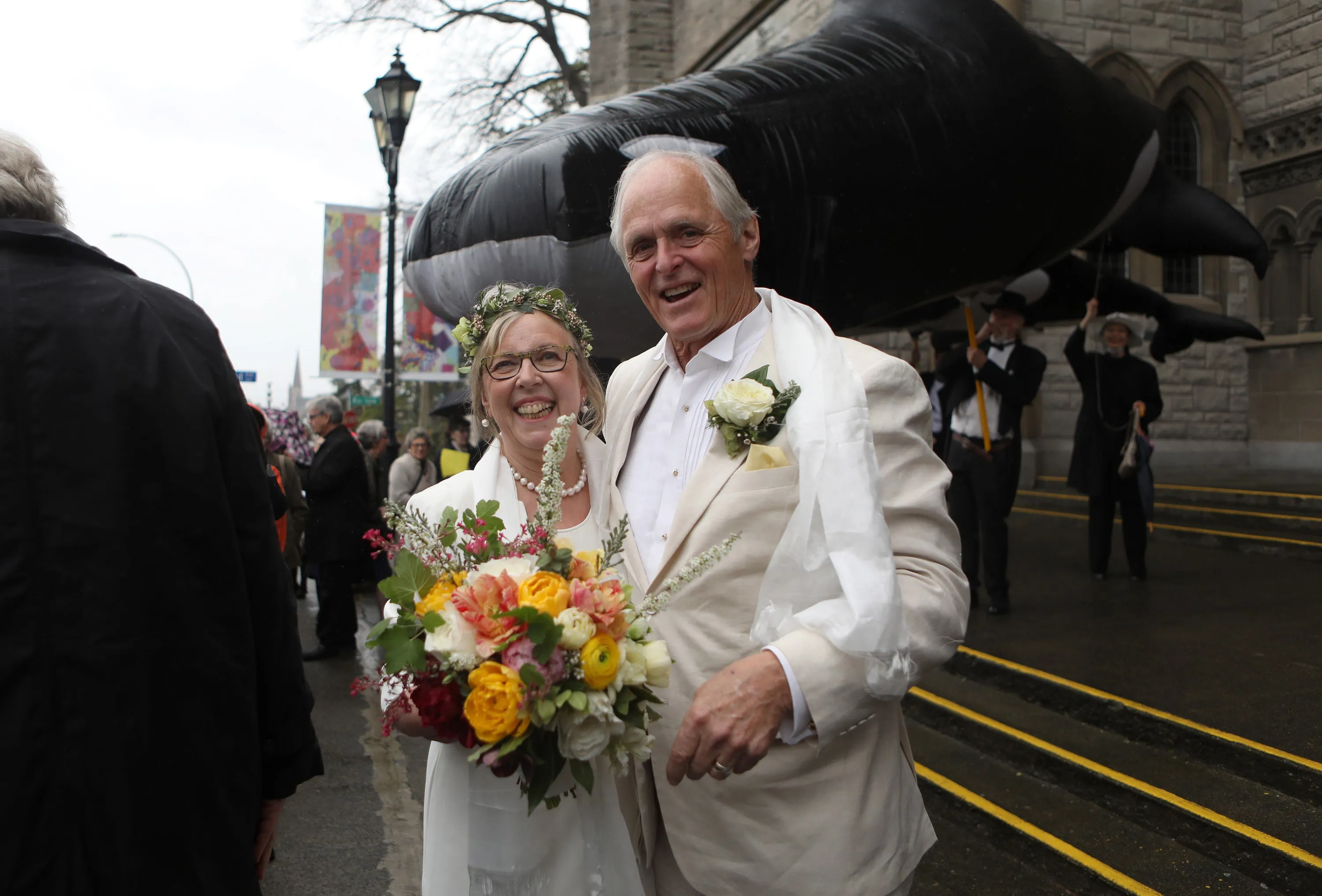Federal Green Party leader Elizabeth May and her husband John Kidder greet the public following their marriage during Earth Day at the Christ Church Cathedral in Victoria, B.C., on Monday, April 22, 2019. (Chad Hipolito/CP)