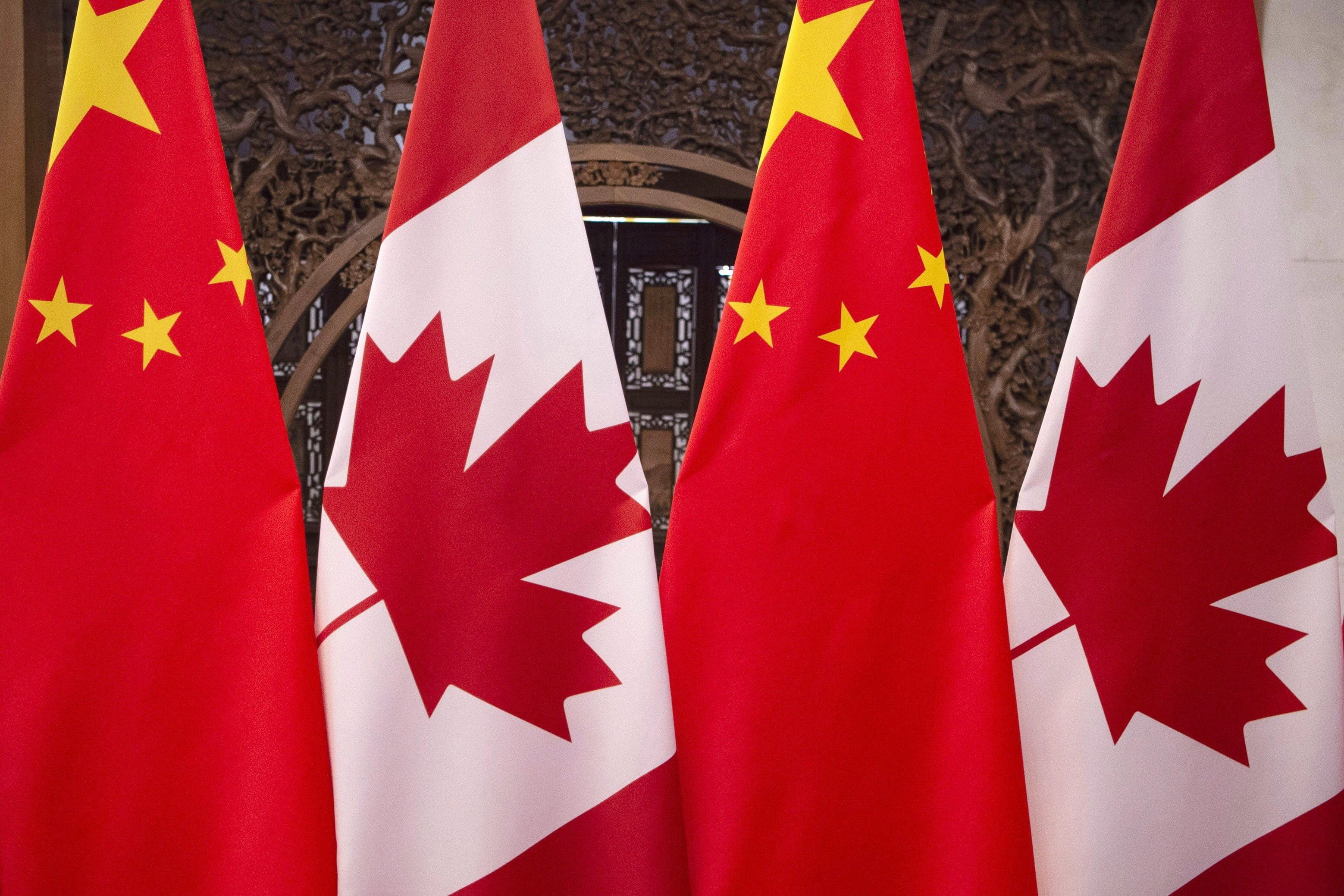 Flags of Canada and China are seen prior to a meeting of Canadian Prime Minister Justin Trudeau and Chinese President Xi Jinping at the Diaoyutai State Guesthouse in Beijing on Dec. 5, 2017. (Fred Dufour/CP/AP)