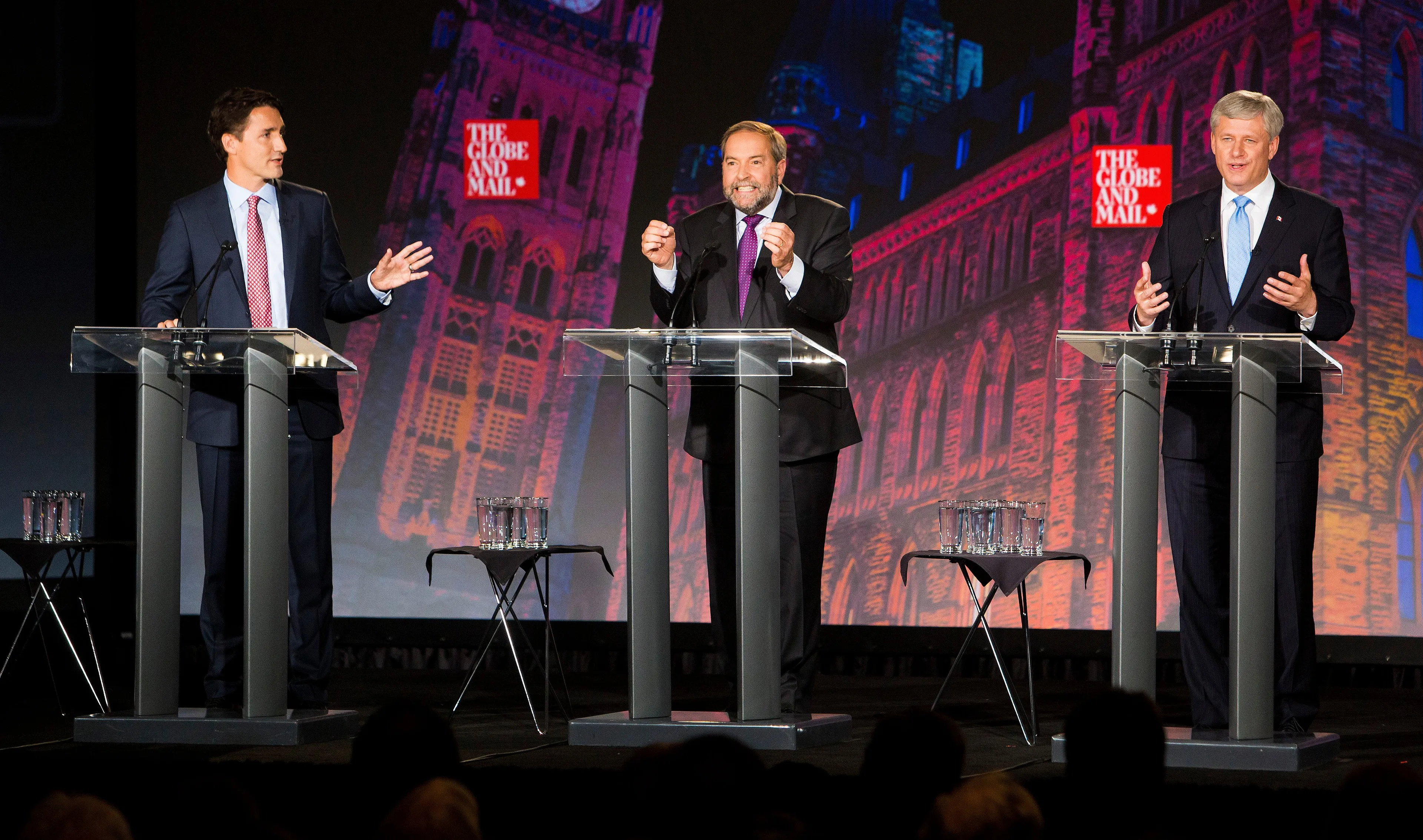 Justin Trudeau, Thomas Mulcair and Stephen Harper, speak during a leaders' debate in Calgary on Sept. 17, 2015. (Ben Nelms/Bloomberg via Getty Images)