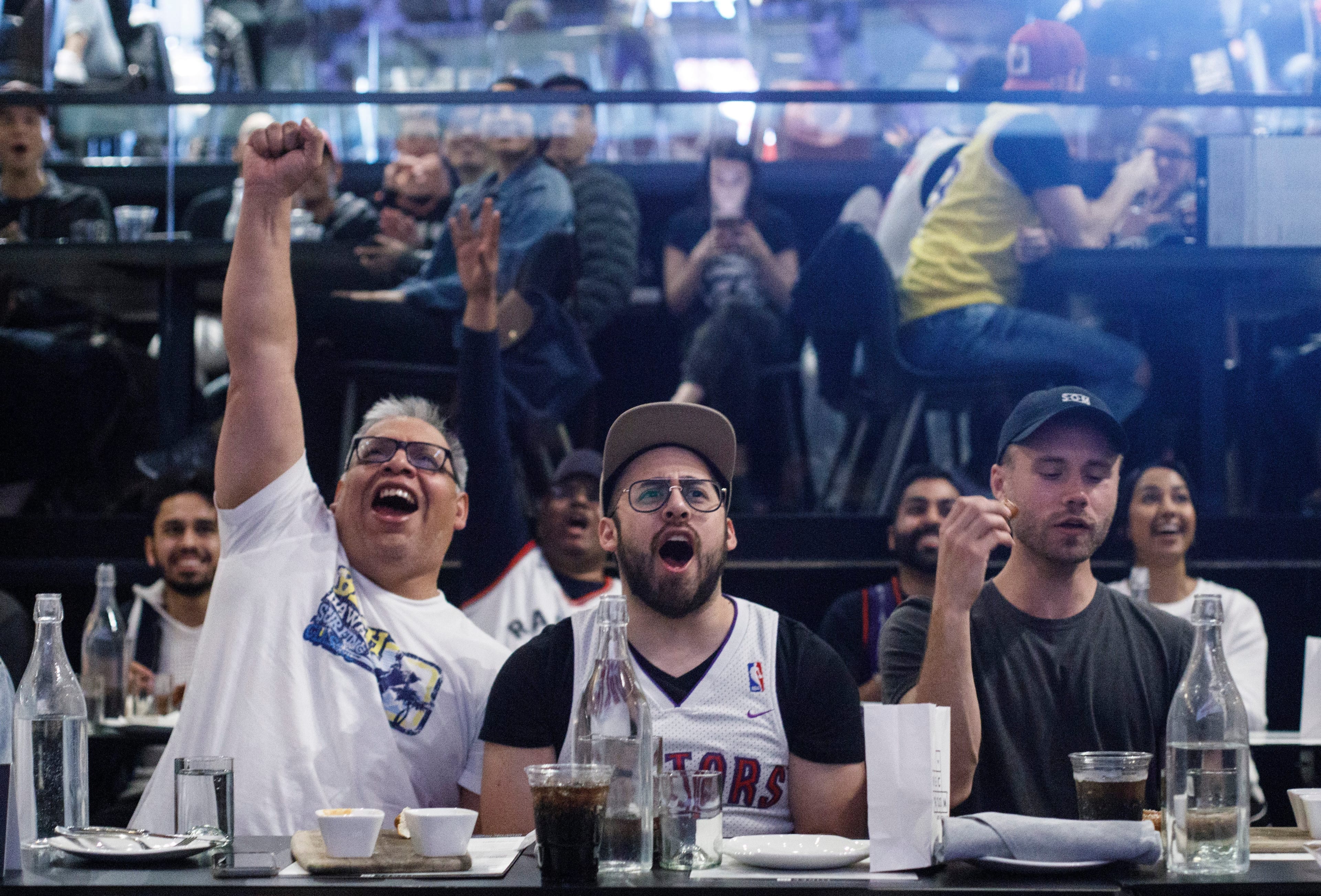 Fans watch the Toronto Raptors take on the Golden State Warriors during Game 5 of the NBA final, in Edmonton on June 10, 2019. (THE CANADIAN PRESS/Jason Franson)