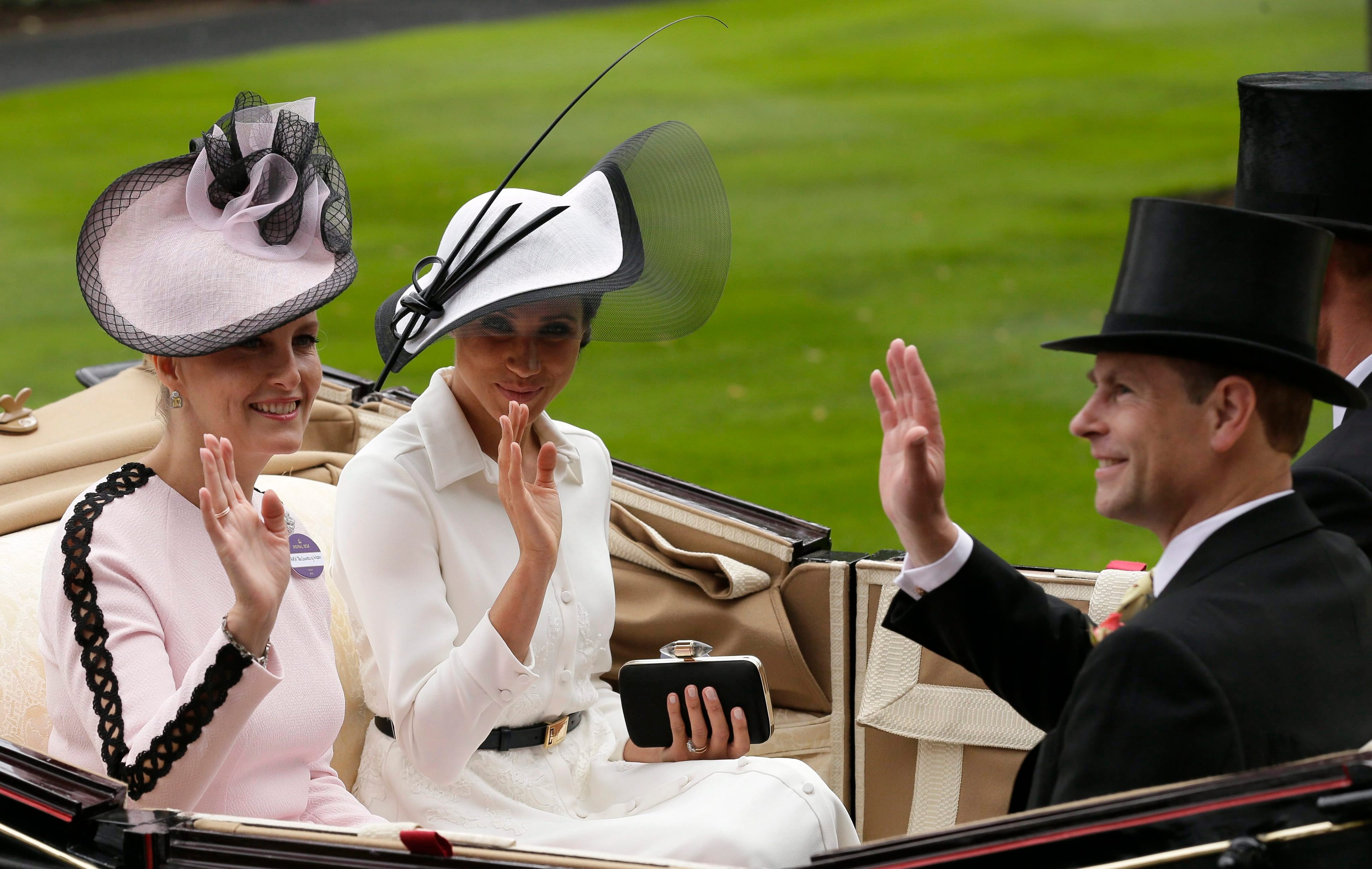 Prince Harry and Meghan, Duchess of Sussex, arrives at the parade ring with Prince Edward, Earl of Wessex, and Sophie, Countess of Wessex, on the first day of the Royal Ascot in Ascot, England, June 19, 2018. (AP Photo/Tim Ireland)