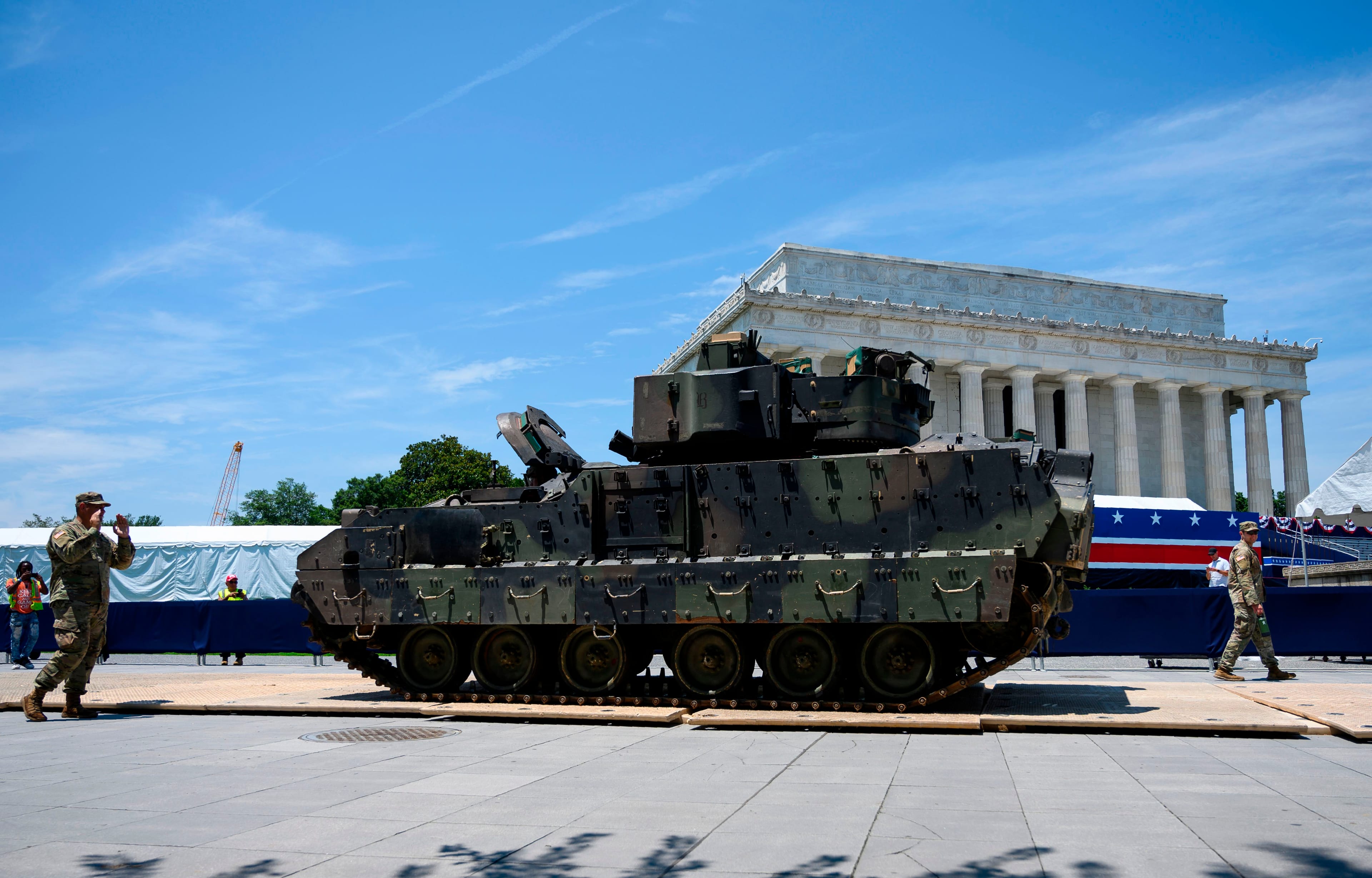 Members of the U.S. military guide a Bradley Fighting Vehicle as preparations are made for the "Salute to America" Fourth of July event with President Donald Trump at the Lincoln Memorial on the National Mall in Washington, D.C. (Andrew Caballero-Reynolds/AFP/Getty Images)