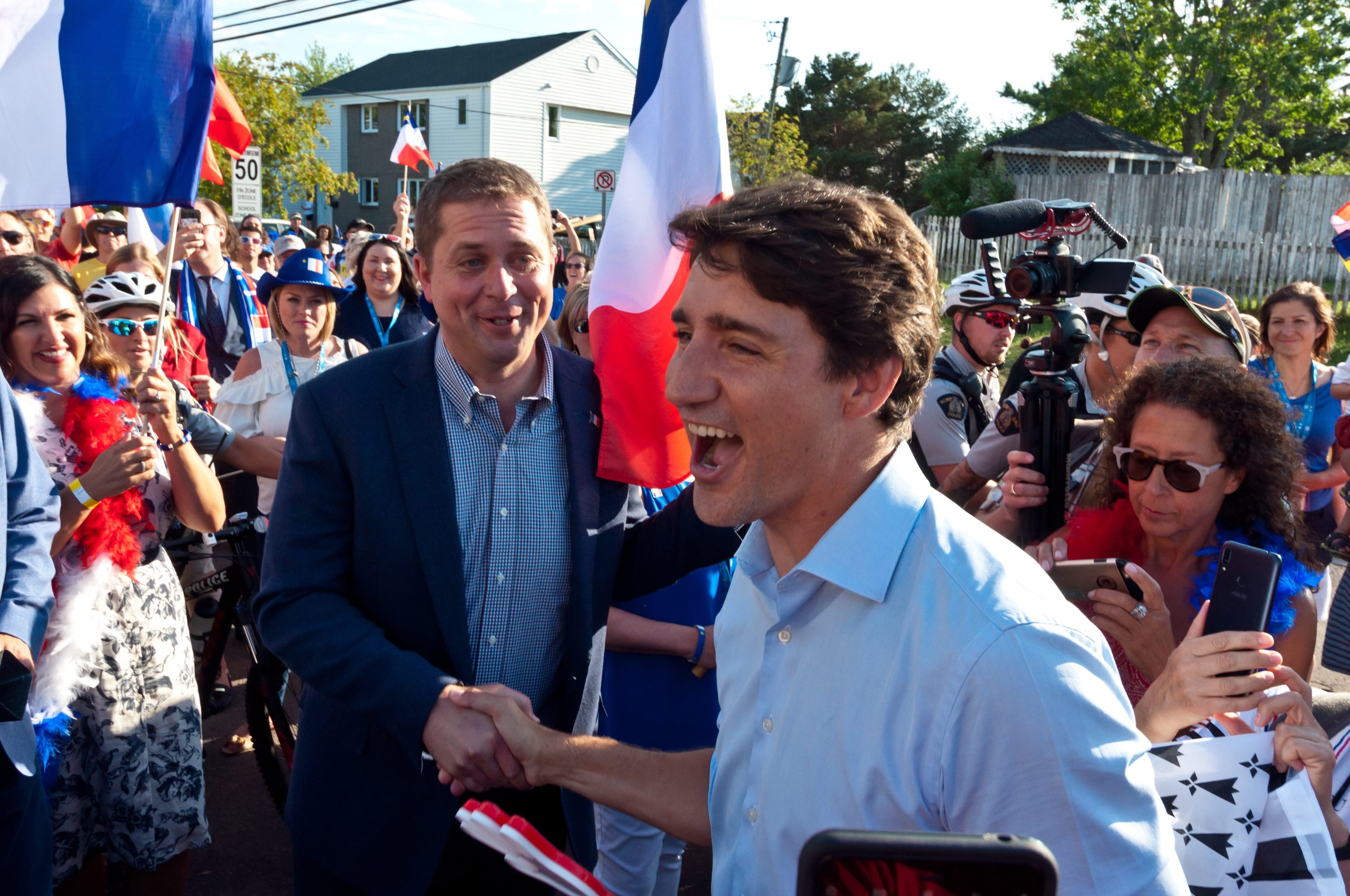 Trudeau shakes hands with Scheer at the World Acadian Congress in Dieppe, N.B., on Aug. 15, 2019 (THE CANADIAN PRESS/Marc Grandmaison)