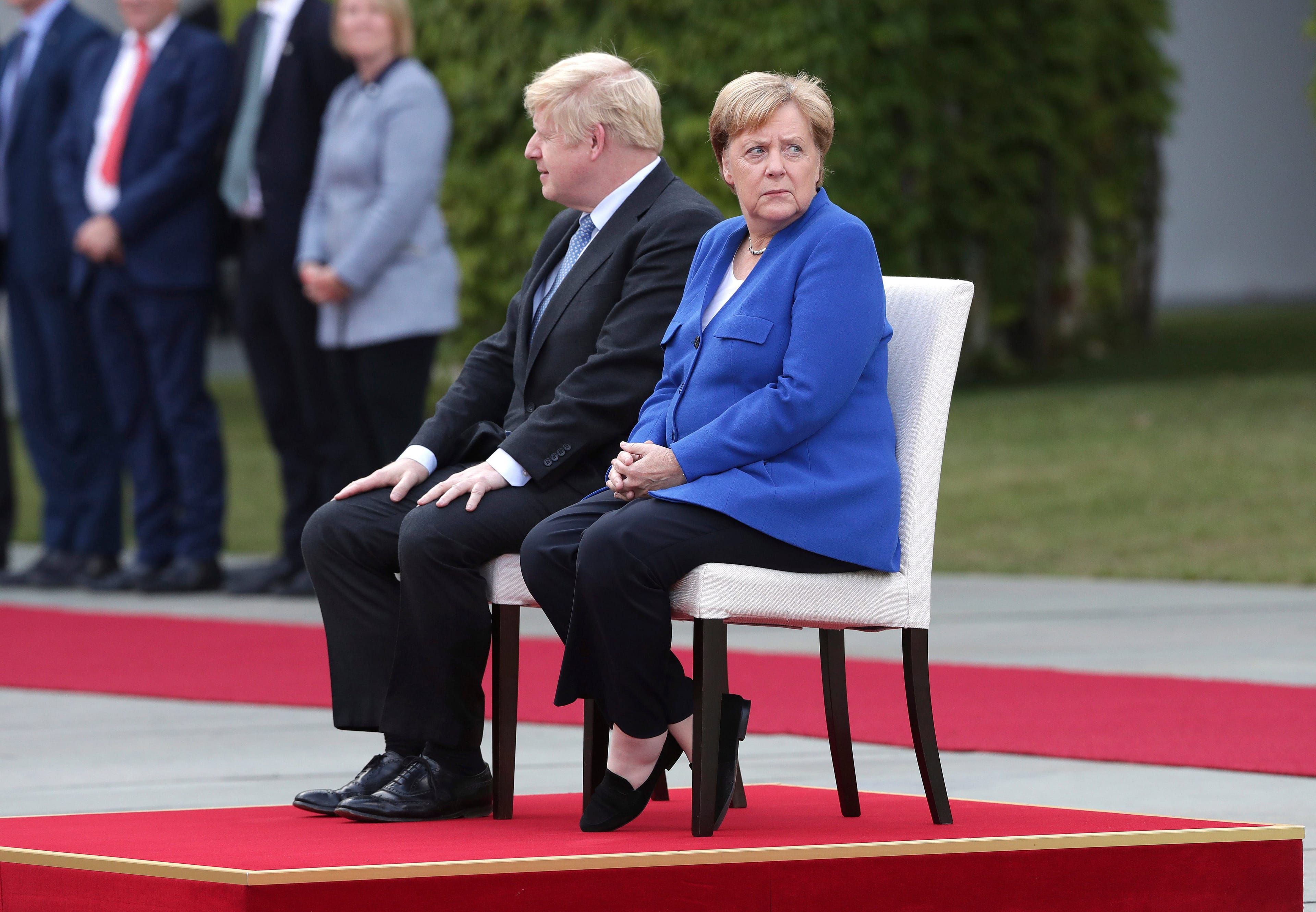 Officially, Merkel "welcomed" Johnson this week with military honours at a meeting in Berlin (Michael Sohn/AP/CP)