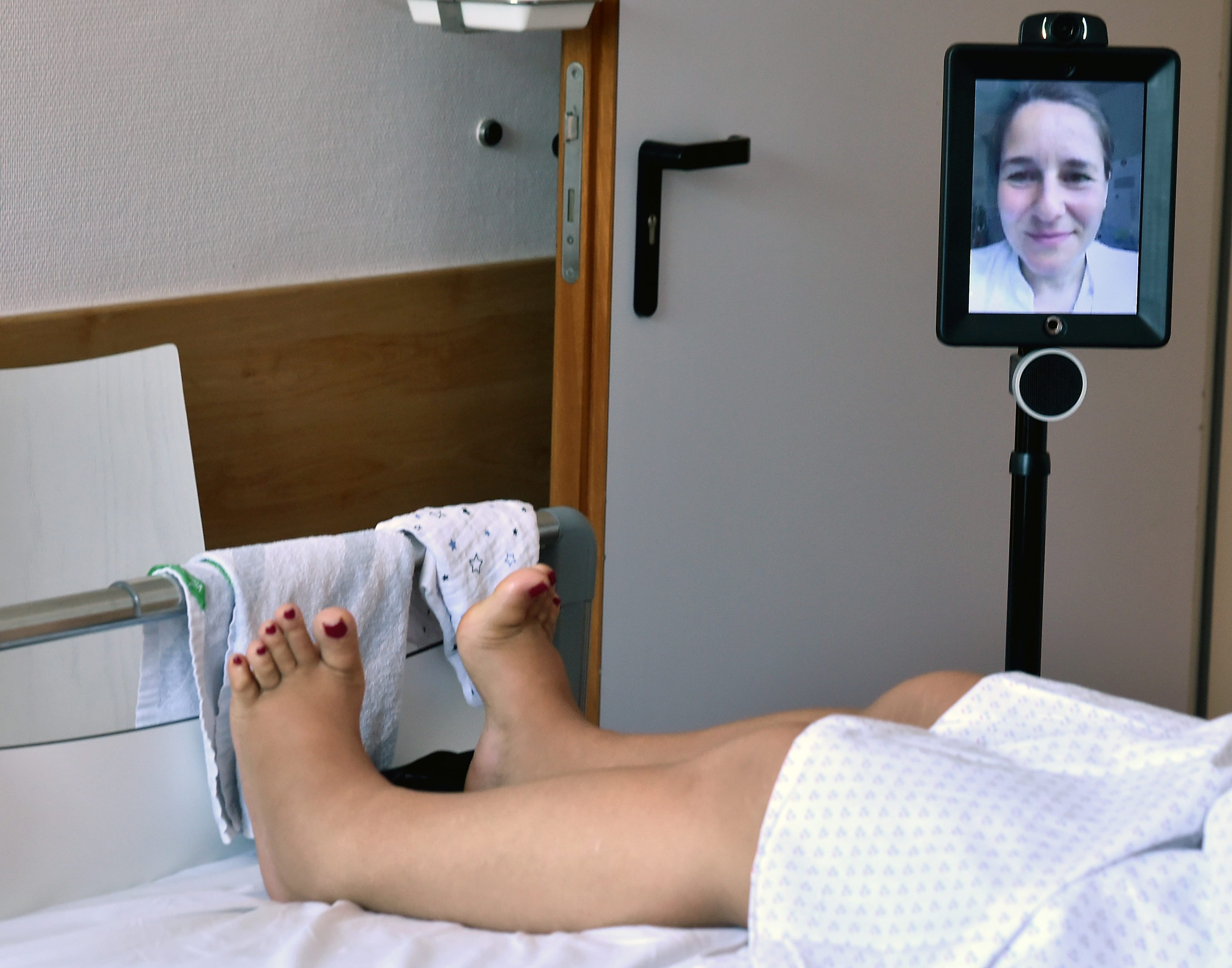 Jun. 25, 2019, Berlin: The nursing robot "Double" is located in the gynaecology clinic at the Auguste-Viktoria-Klinikum at a woman's bed. Chief physician Mandy Mangler is connected to a screen and can thus talk to the patients, even if she cannot be there personally. (Bernd Settnik/Getty)