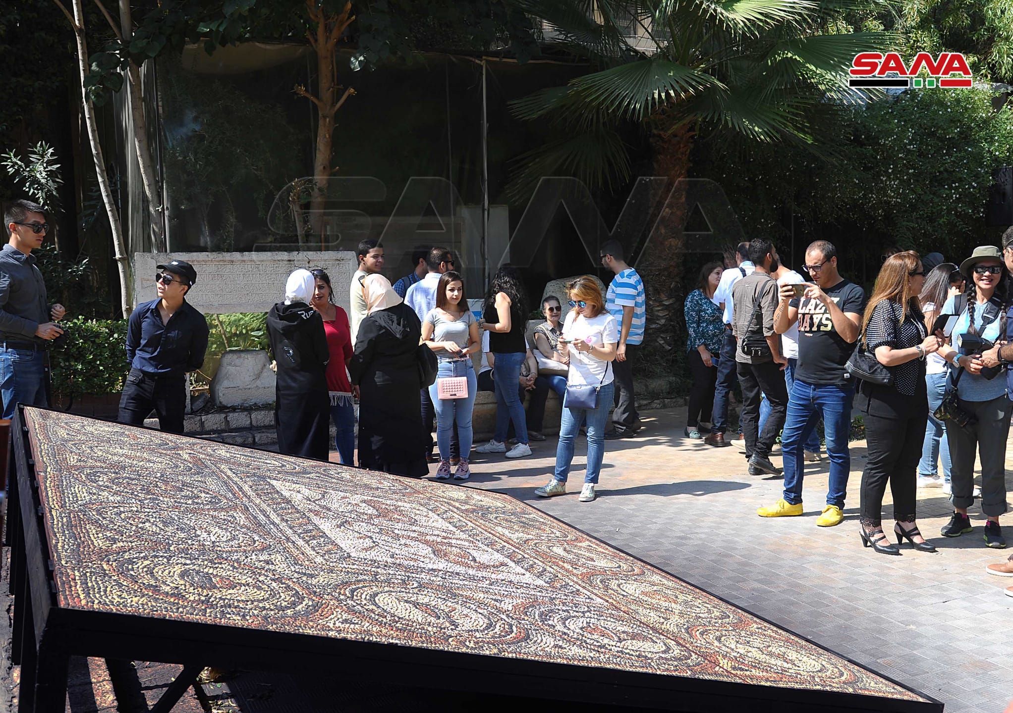 The unveiling of the 1,800-kilogram, late 5th Century Byzantine Christian mosaic at the National Museum on Damascus, as seen on the website of Syria's state news agency. The mosaic had previously been at the Montreal Museum of Fine Arts. (SANA)