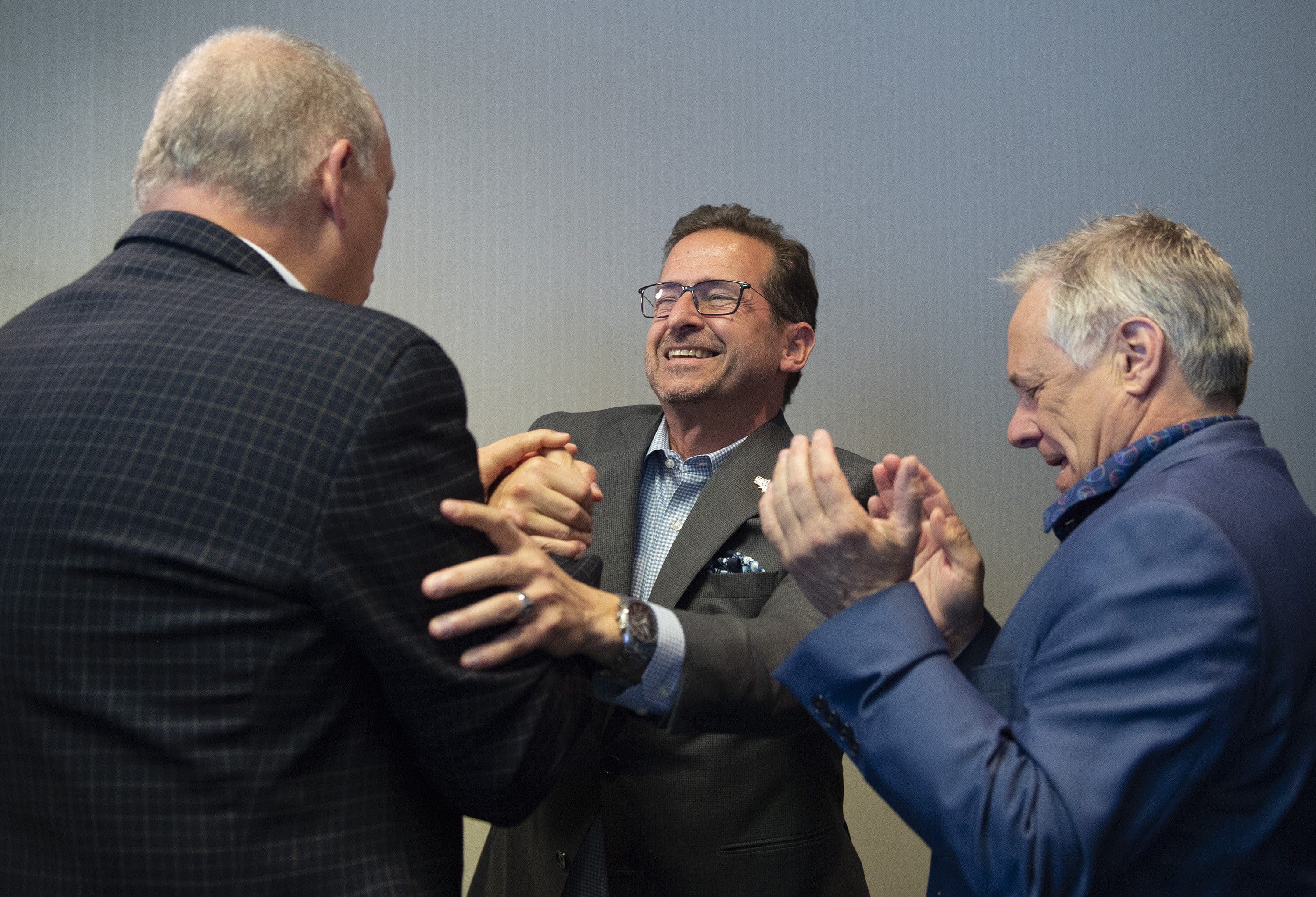 Bloc Quebecois Leader Yves-Francois Blanchet (centre) greets new Bloc MPs as he arrives at the first party caucus in Quebec City on Oct. 24, 2019 (Jacques Boissinot/CP)