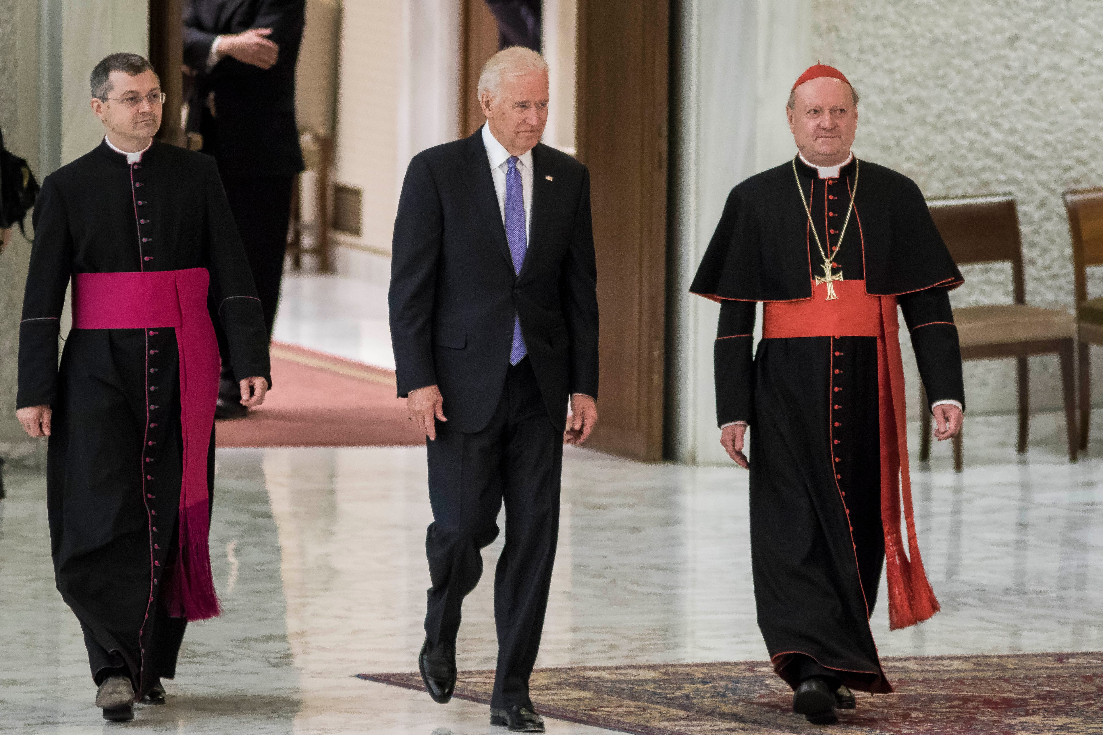 US Vice President Joe Biden (C) is flanked by Cardinal Gianfranco Ravasi (R) as he arrives to attend a special audience celebrates by Pope Francis in Vatican City on Apr. 29, 2016. (Giuseppe Ciccia/NurPhoto/Getty)