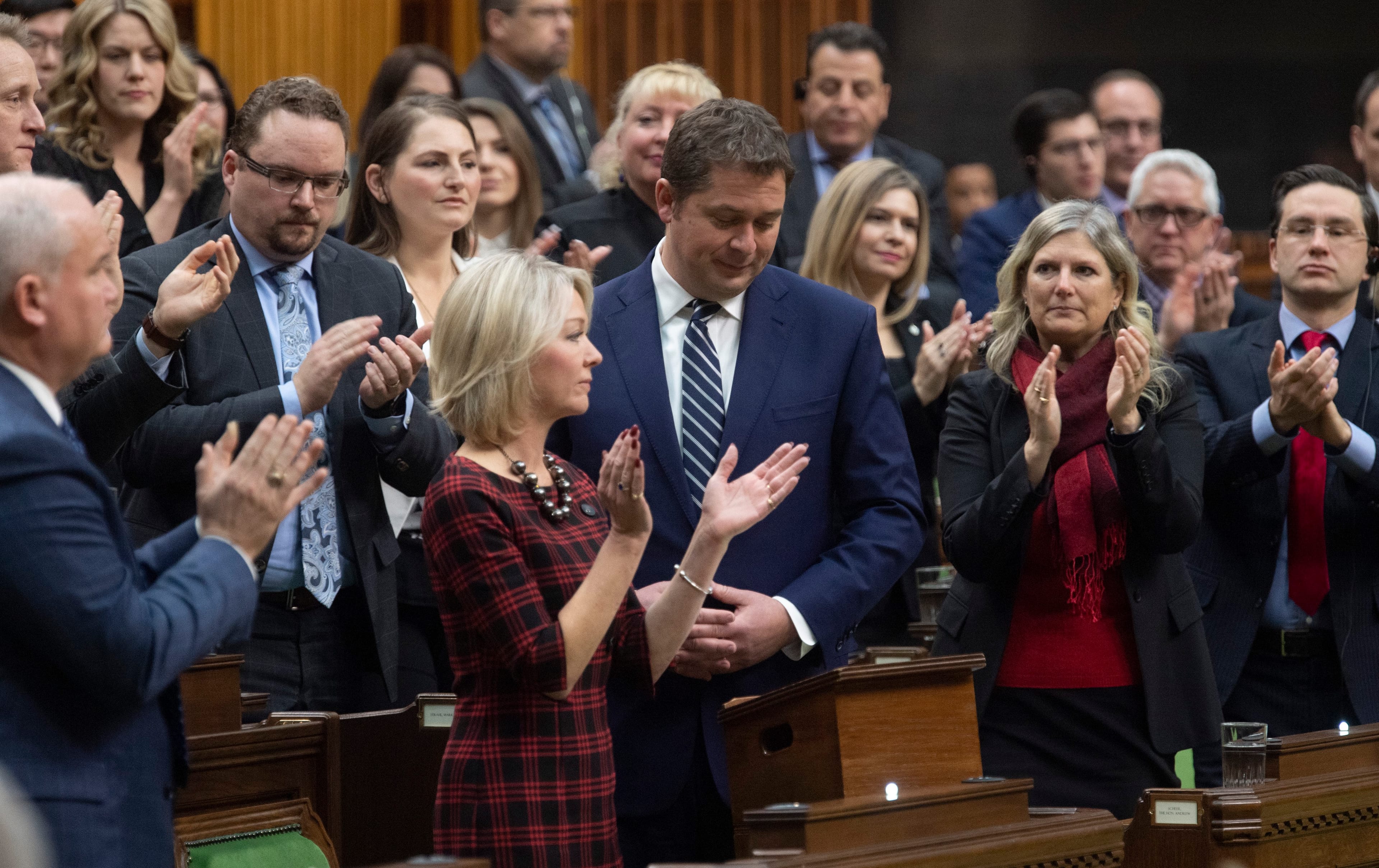 MP's applaud Scheer during his announcement that he will step down as leader, on Dec. 12, 2019 in the House of Commons (Adrian Wyld/CP)