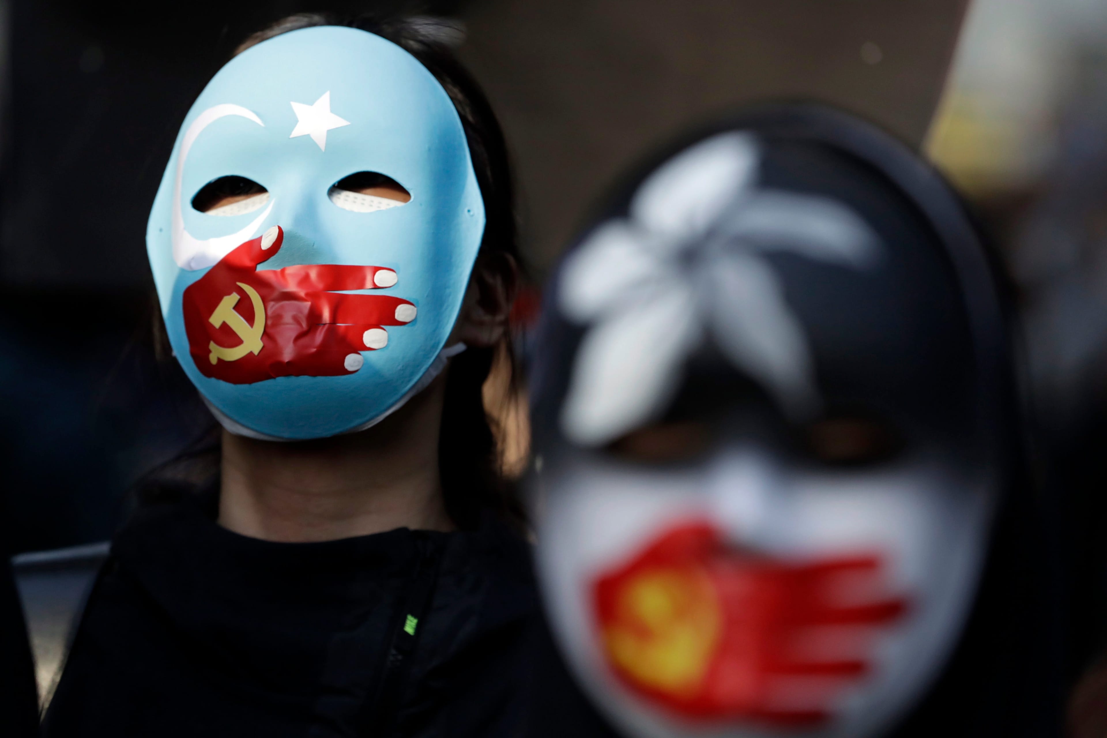 Pro-democracy protesters demonstrate on a street during a protest in Hong Kong on Dec. 8, 2019. (Mark Schiefelbein/AP/CP)