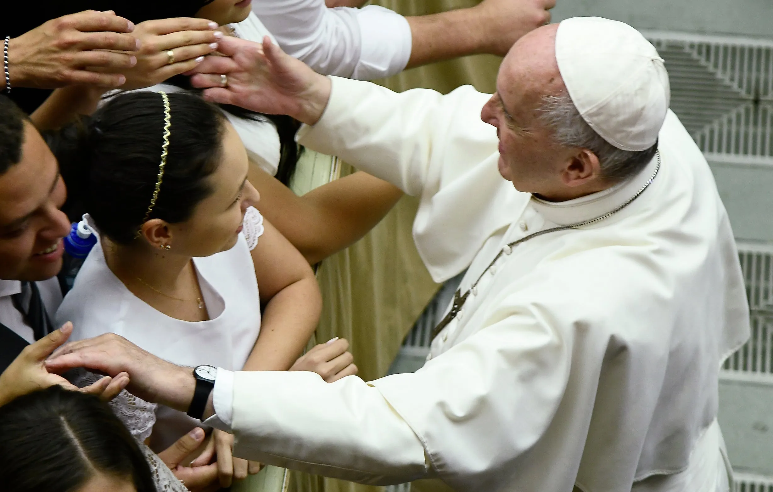 Pope Francis blesses a newly married couple during his weekly general audience at the Vatican on Aug. 21, 2019 (FILIPPO MONTEFORTE/AFP via Getty Images)