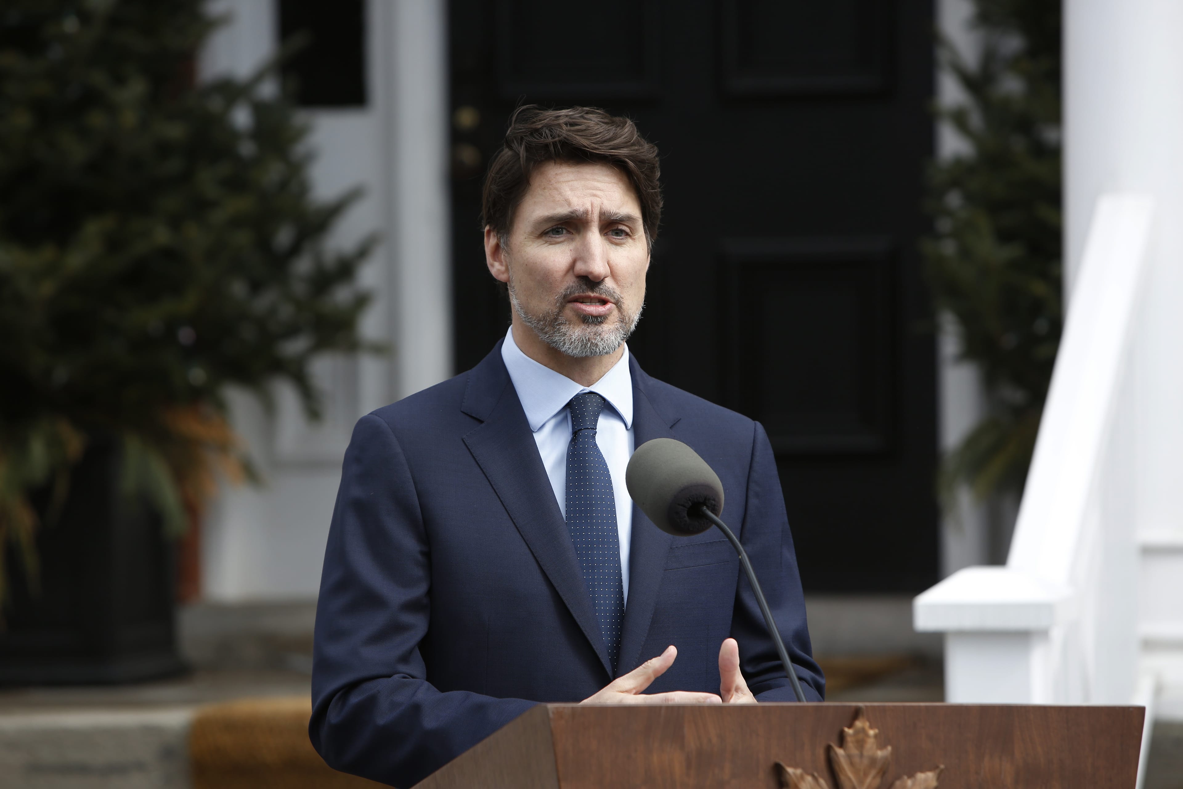 Justin Trudeau, Canada's prime minister, speaks to members of the media outside of his residence at Rideau Cottage in Ottawa, Ontario, Canada on Friday, March 13, 2020. Trudeau said Canada will introduce a "significant" fiscal stimulus package, as part of a coordinated effort with other Group of Seven countries to counter the virus-driven global economic slowdown and calm markets. Photographer: David Kawai/Bloomberg via Getty Images