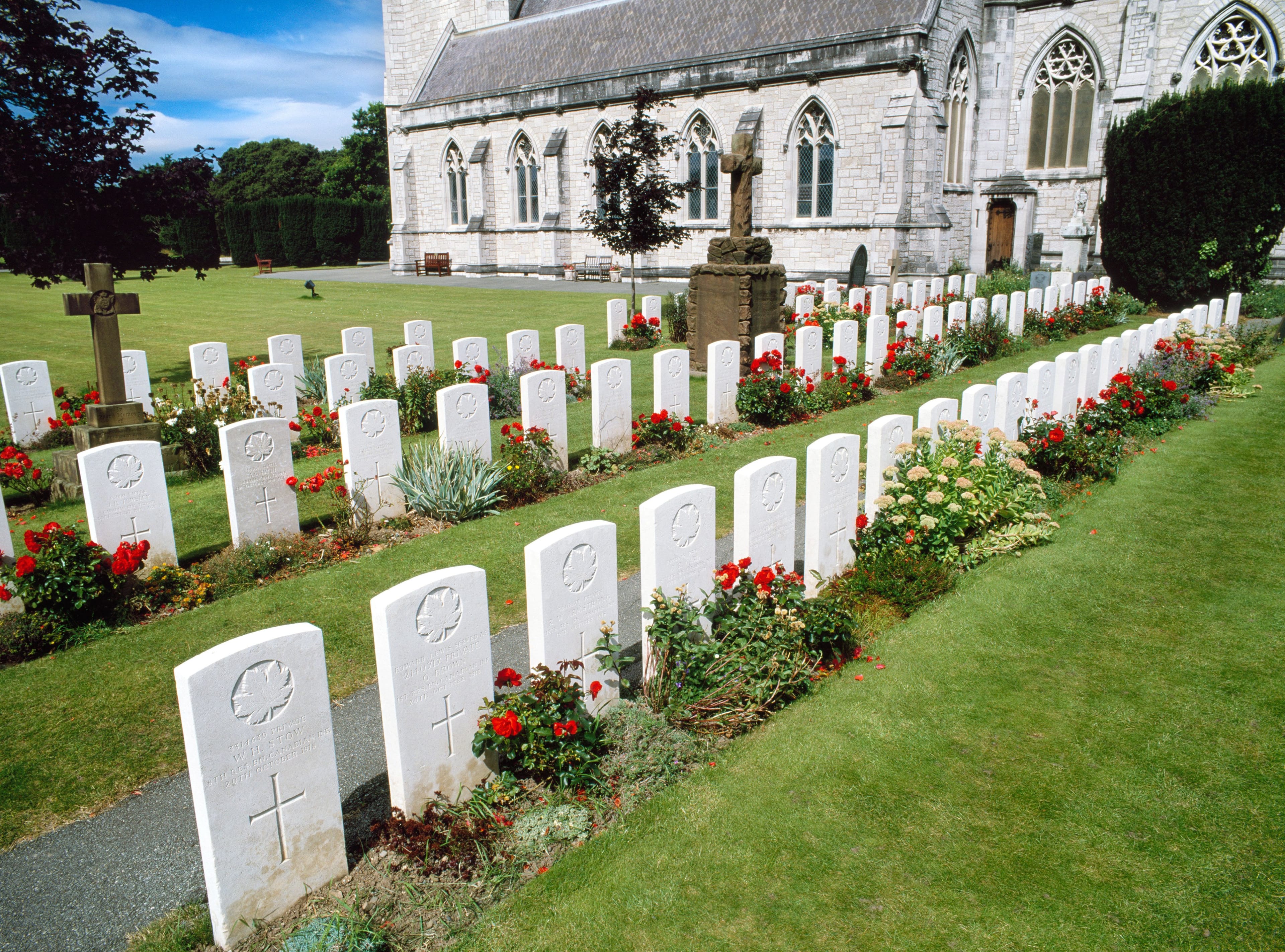 World War One military headstones at St Margaret's Church in Bodelwyddan, Wales, for Canadian soldiers who died from Spanish flu pandemic. (Jean Williamson/Alamy)