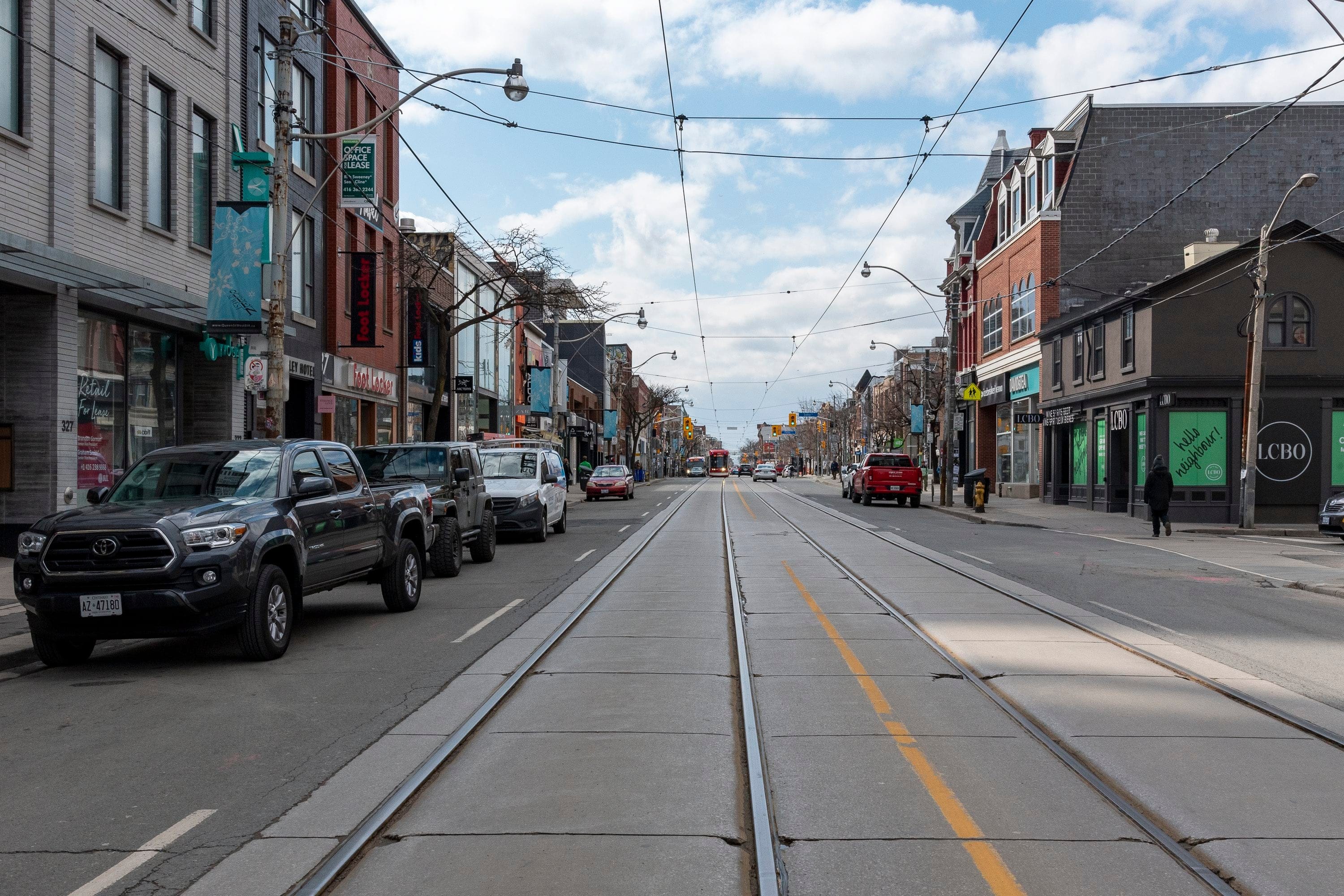 A normally busy Queen Street West in downtown Toronto is largely empty due to many closures related to COVID-19 preventative measures in Toronto, Ont. on March 17, 2020. (Dominic Chan/CP)