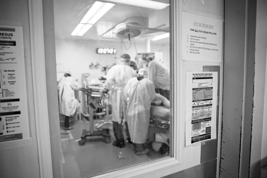 The resuscitation room’s door seals tightly to contain any infected aerosols carrying COVID-19 as the emergency team performs a ‘crash intubation.’(Dawn Lim)