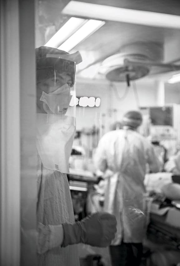 From inside the resuscitation room, emergency nurse Michael De Wit communicates the team leader’s requests to the ‘runner doctor’ who supports the team from the outside by gathering further details from paramedics or the patient’s medical records. (Dawn Lim)