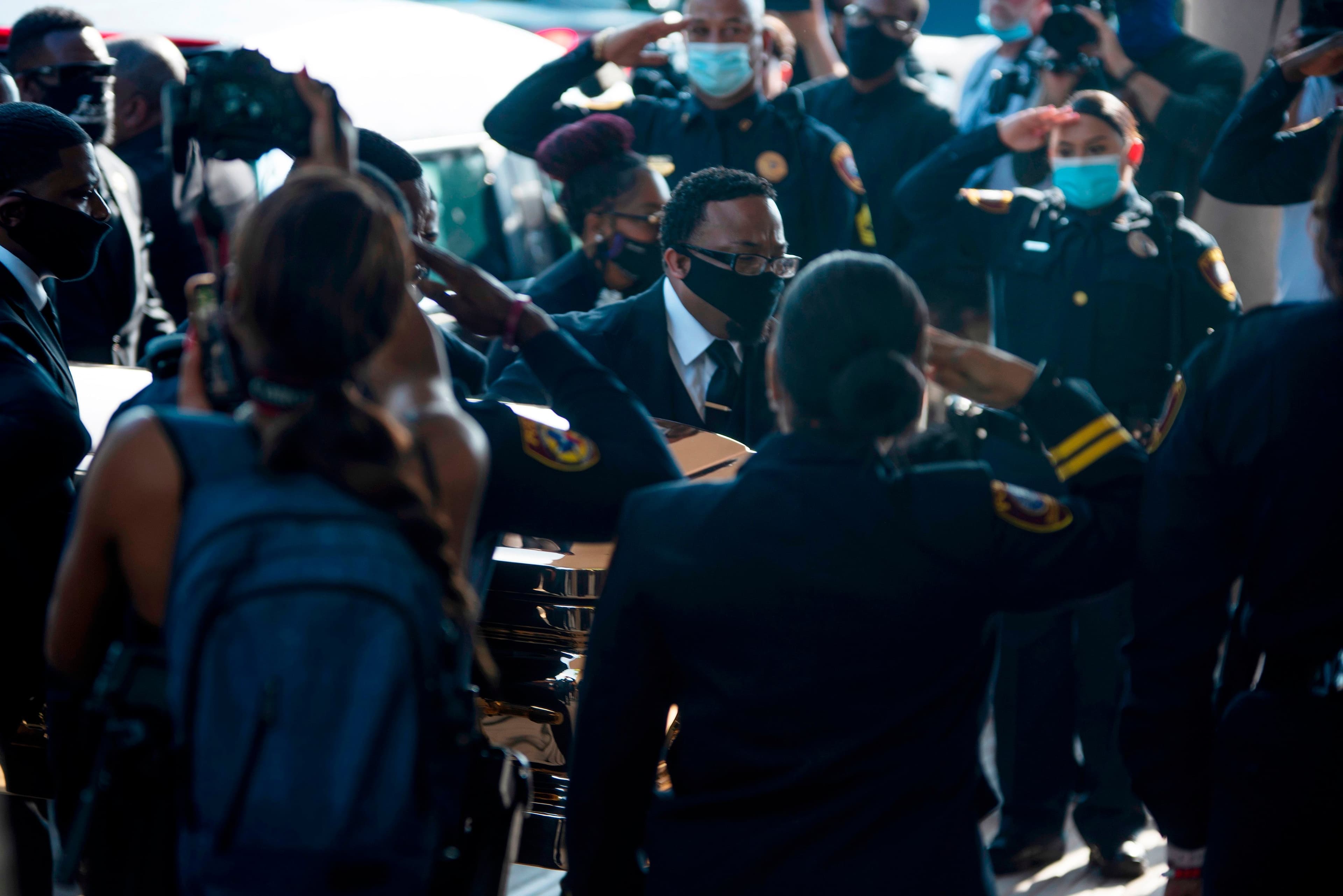 The perplexing sight of cops saluting George Floyd's casket