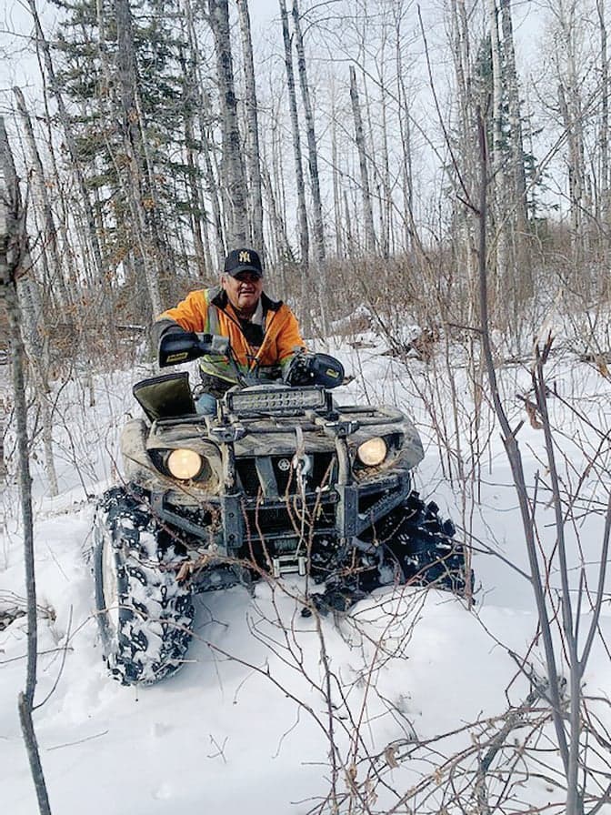 Morris Cardinal worked as a hunting guide. Seen here on his beloved quad near Seibert Lake, AB on the day he was killed. (Courtesy of Gina Levasseur)