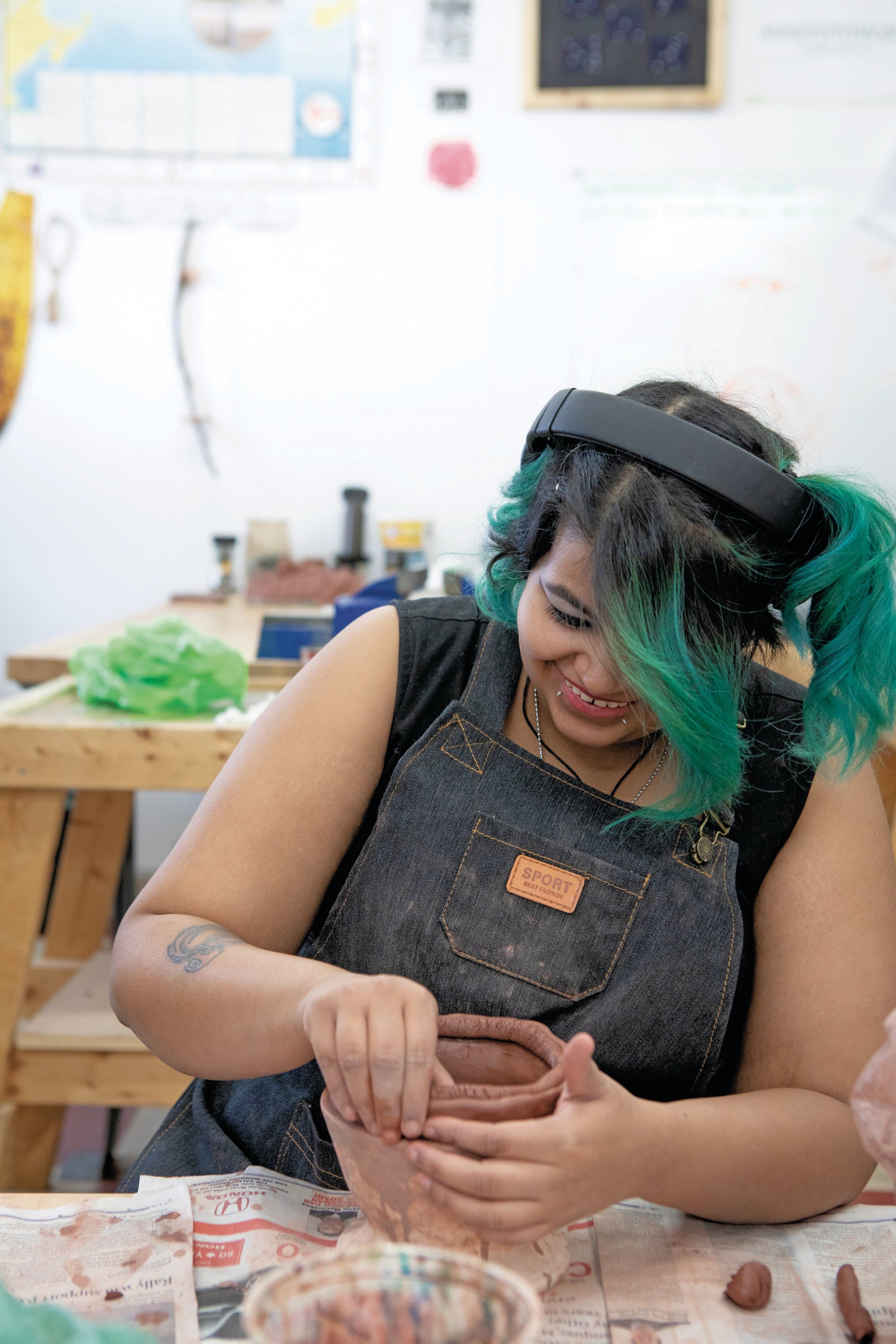 Amba Sharma makes pottery in the Aboriginal Visual Arts program at NBCCD
