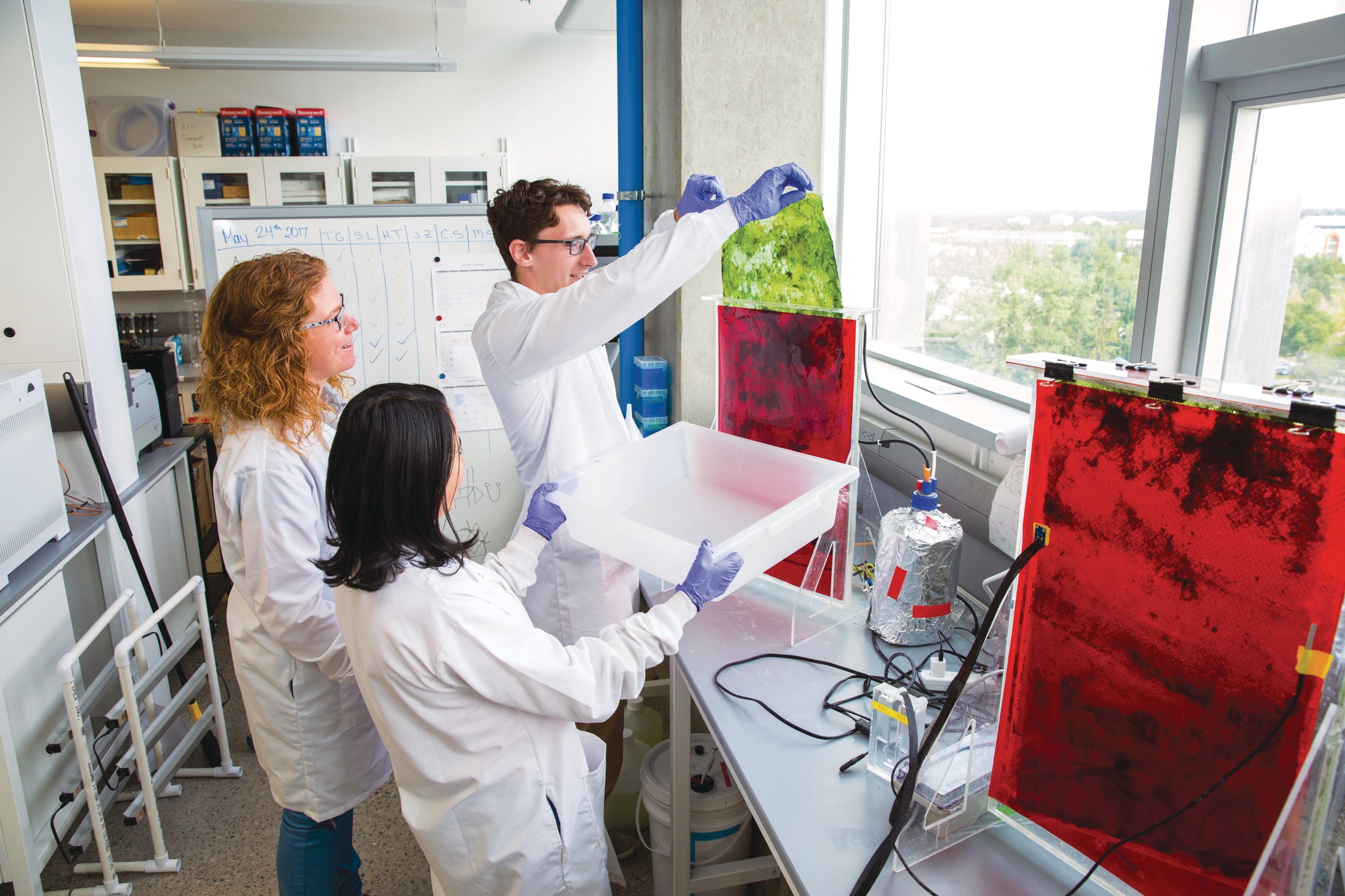 Postdoctoral Fellow in the Energy Bioengineering Group Christine Sharp, Research Assistant Karen Andrea Canon-Rubio, and undergraduate student Zack Urquhart have been bringing bioreactors into elementary school classrooms. (Courtesy of University of Calgary)