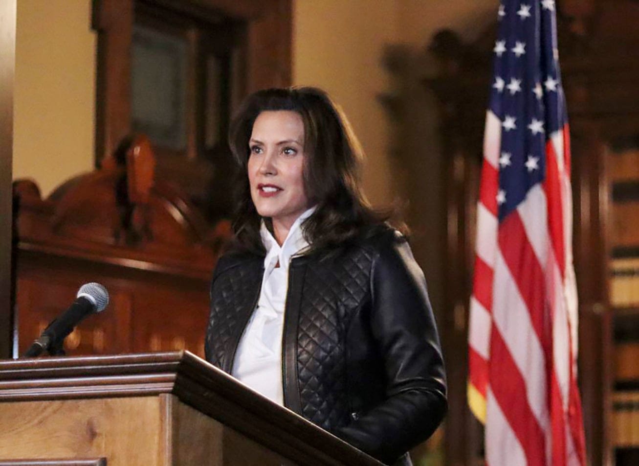 In a photo provided by the Michigan Office of the Governor, Michigan Gov. Gretchen Whitmer addresses the state during a speech in Lansing, Mich., Thursday, Oct. 8, 2020. The governor delivered remarks addressing Michiganders after the Michigan Attorney General, Michigan State Police, U.S. Department of Justice, and FBI announced state and federal charges against 13 members of two militia groups who were preparing to kidnap and possibly kill the governor. (Michigan Office of the Governor via AP/CP)