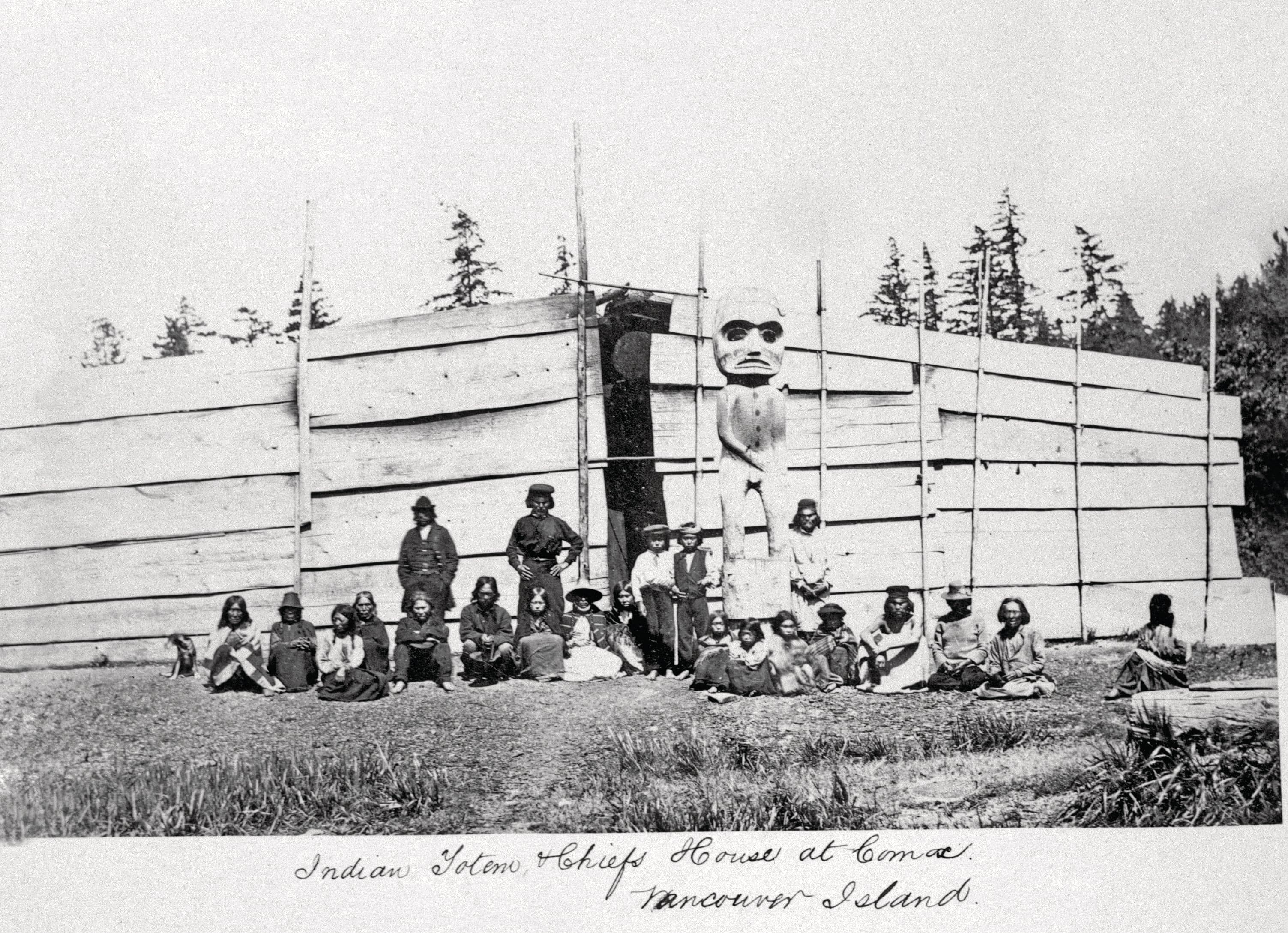 A photo taken outside a chief’s house in the Comox area sometime between 1866 and 1870 (Image C-09265 courtesy of the Royal BC Museum)
