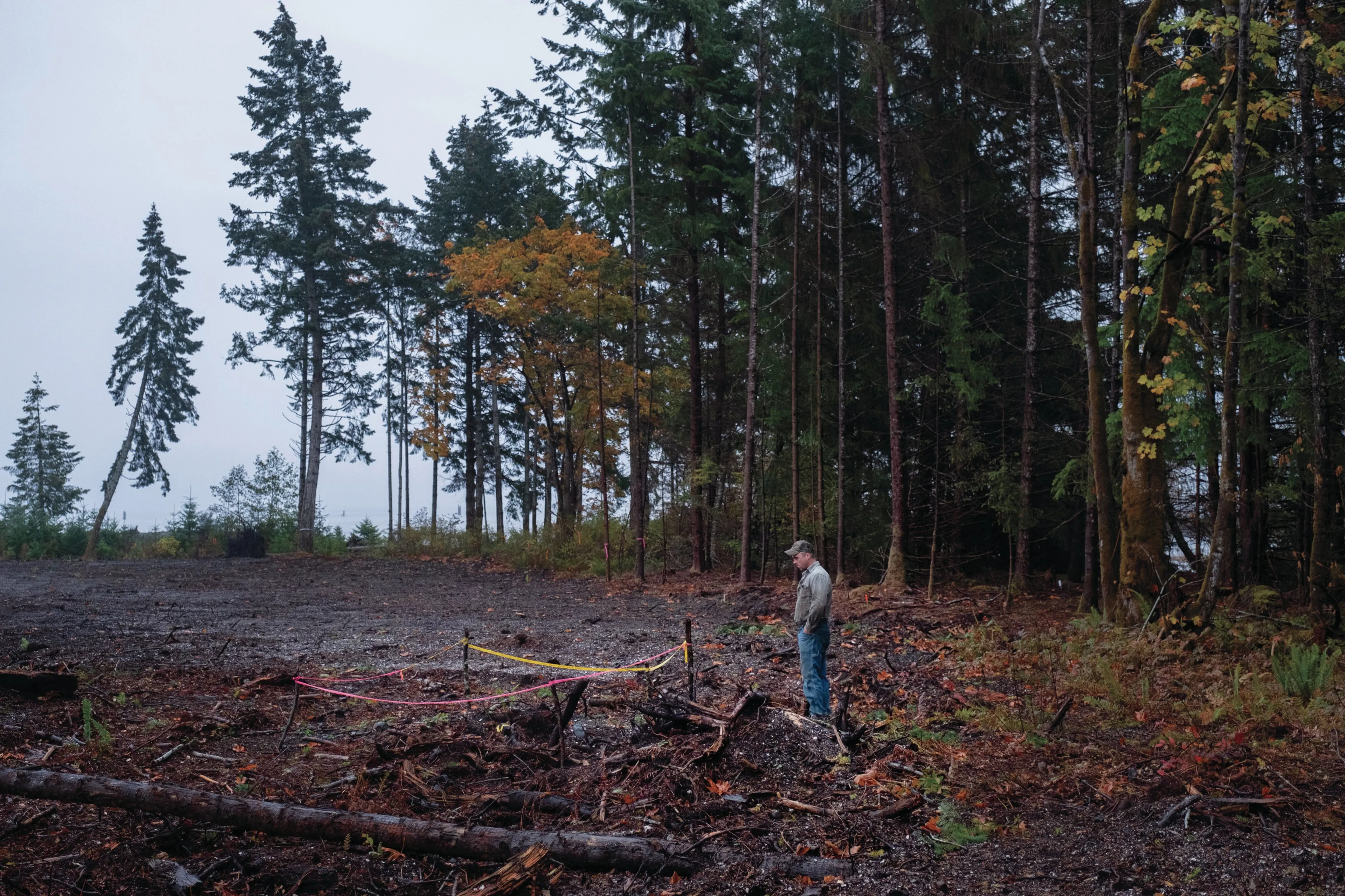 McKay stands near the taped-off area where his excavator turned up a human skull (Photograph by Jen Osborne)