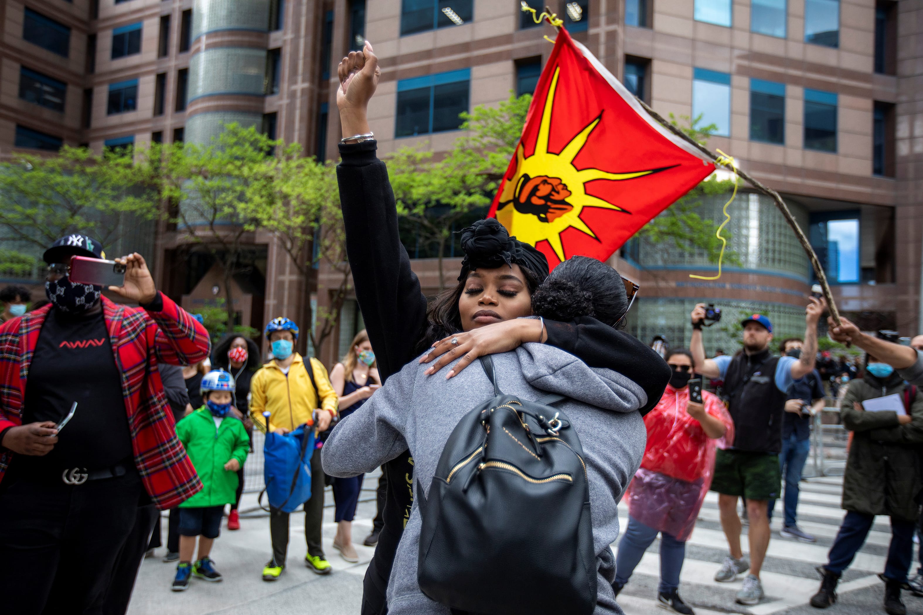 Outside Toronto Police headquarters, protesters highlight the deaths in the U.S. of Ahmaud Arbery, Breonna Taylor and George Floyd, and of Toronto's Regis Korchiniski-Paquet (Carlos Osorio/Reuters)