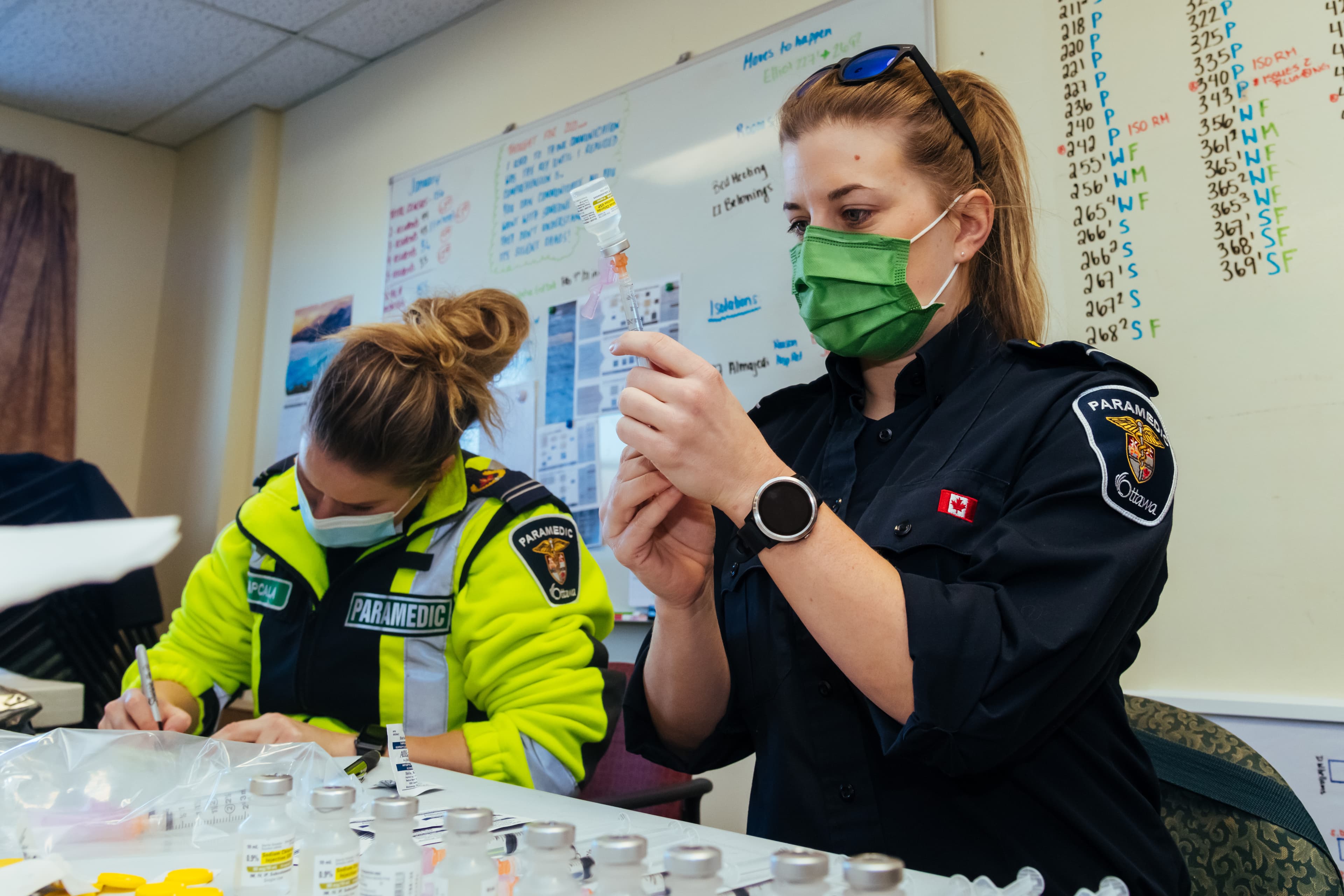 Paramedics prepare COVID-19 vaccines at the Extendicare West End Villa in Ottawa (Courtesy of City of Ottawa)