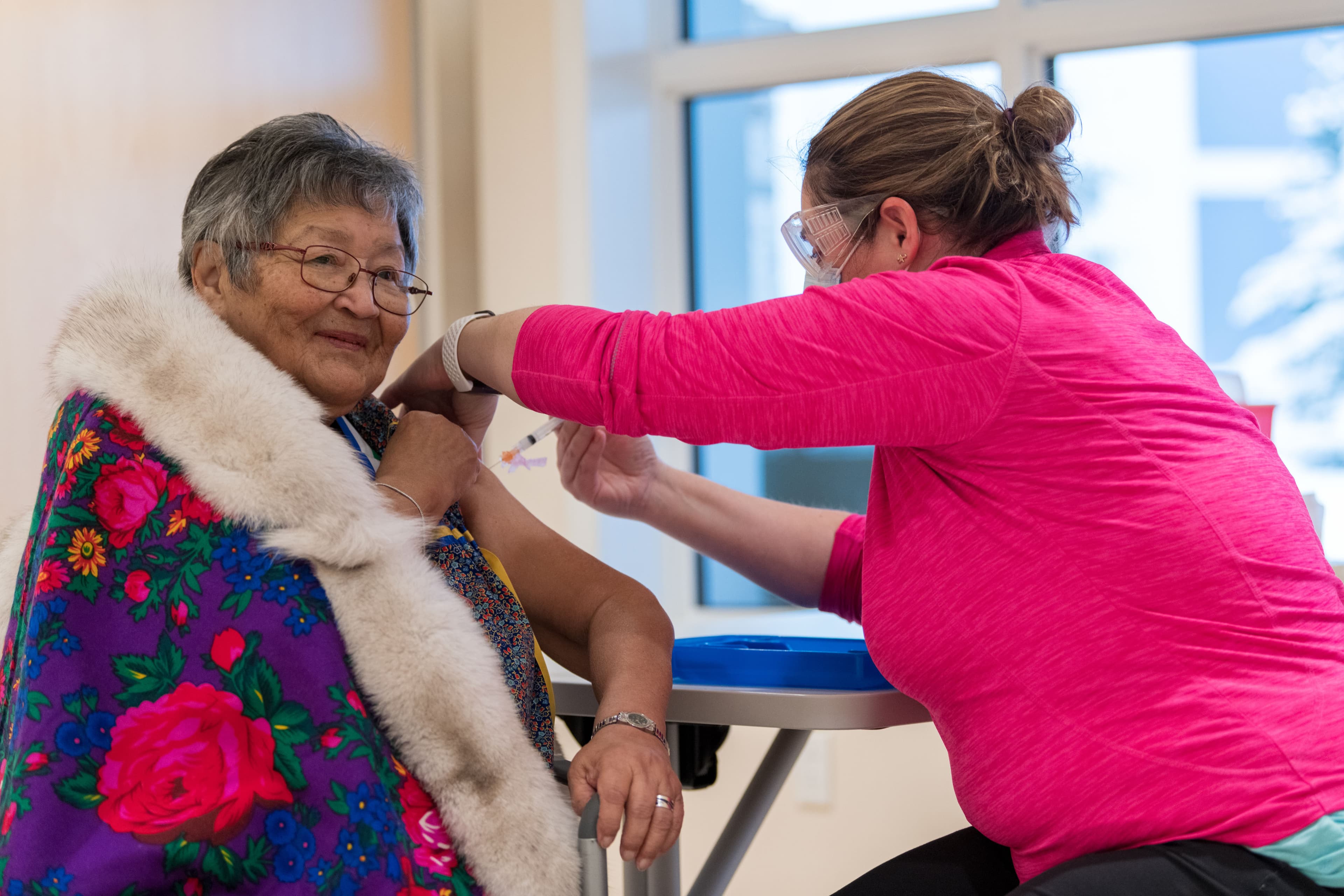 Agnes Mills receives her immunization. (Courtesy of Mark Kelly Photography/Yukon Health and Social Services)
