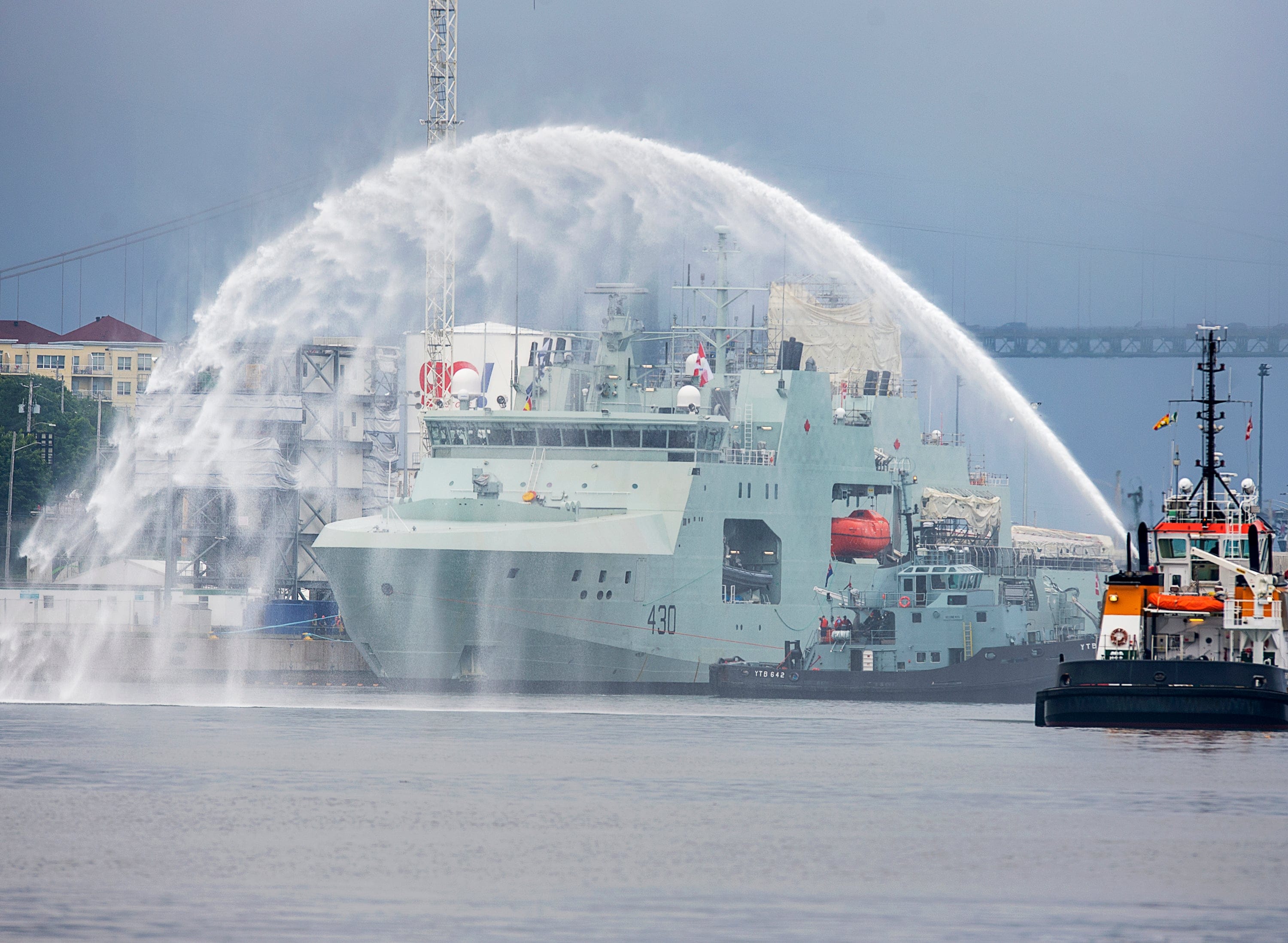 HMCS Harry deWolf heads from the Halifax Shipyard on its way to being delivered to the Royal Canadian Navy dockyard in Halifax on July 31, 2020 (CP/Andrew Vaughan)