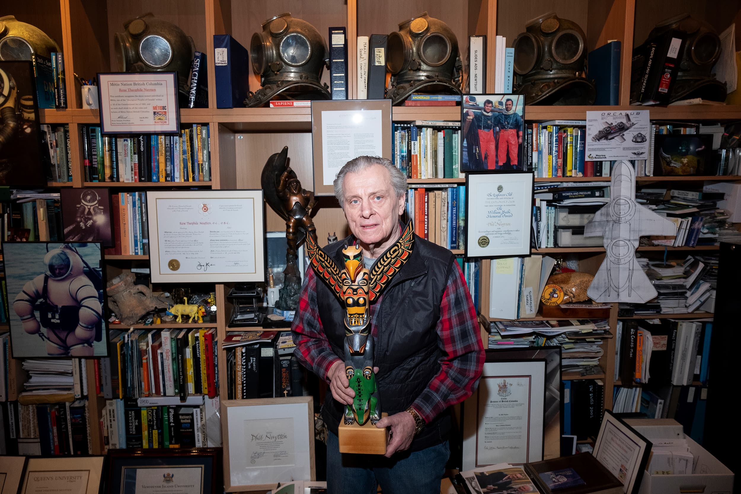 Nuytten in his office holding a carving he made (Photograph by Jen Osborne)