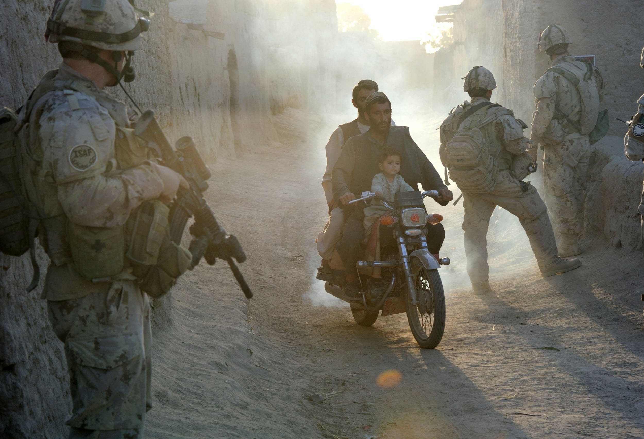 Passing through an early morning checkpoint in Kandahar in 2011, the year Canadian soldiers were brought home (Courtesy of Sergeant Matthew McGregor/DND-MDN)