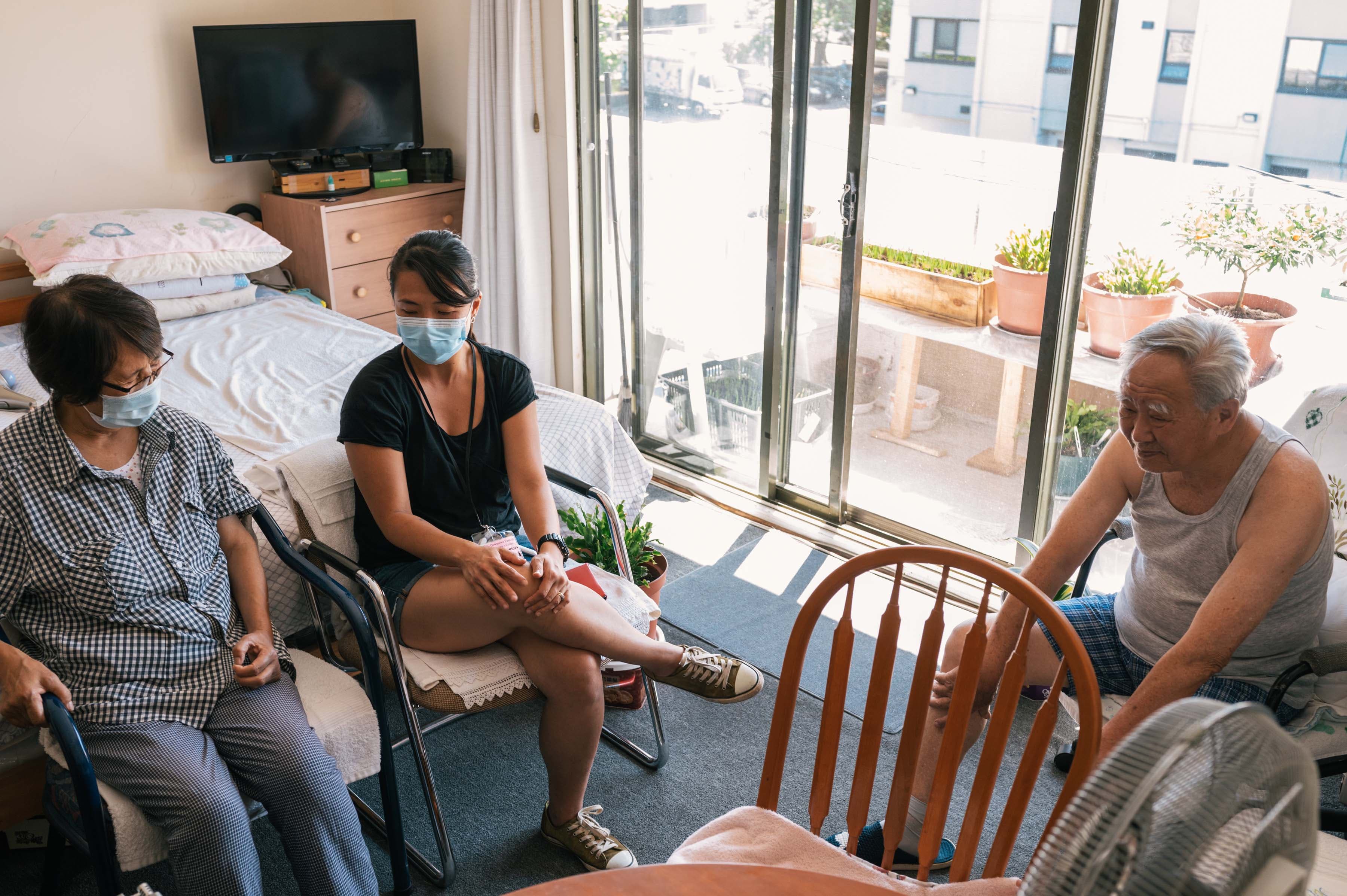 Xiaowen Shi, 73, and her husband Bing Xu Jiao, 83, rely on the help of Teng Lai Lim, a Chinese Seniors outreach worker with the Downtown Eastside Women’s Centre, with their everyday needs. Teng Lai wishes there was more funding for more Chinese Seniors outreach workers. (Photograph by Felicia Chang)