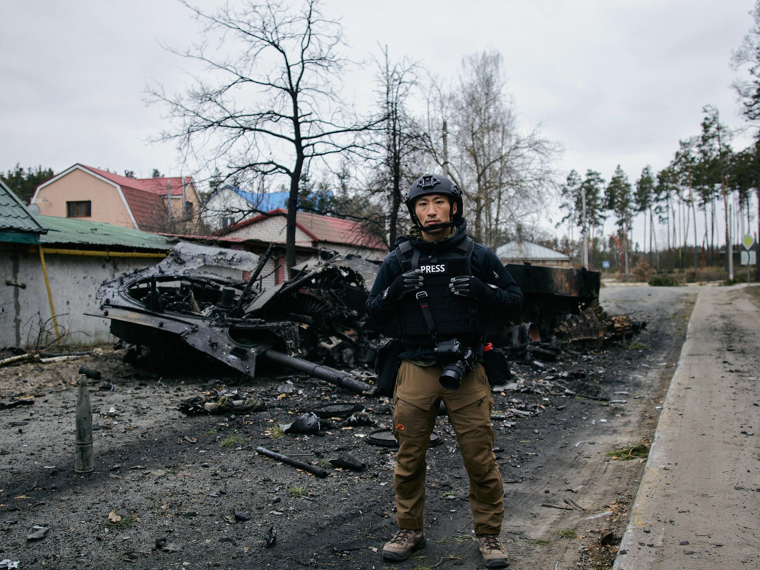 Irpin, March 13. “My photography partner, Zach Lowry, took this photo. I’m in a flak vest and helmet standing in front of a Russian armoured vehicle. A Ukrainian soldier told us it was one of the first Russian vehicles that came into Irpin, but the military destroyed it before it reached the bridge to Kyiv.” (Photograph by Zach Lowry)