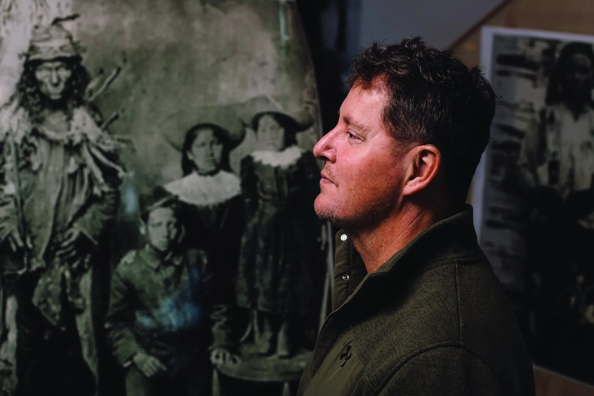 Dean Lerat often spends 30 hours a week working on his genealogy project at home in Regina, Saskatchewan. Black-and-white snapshots of his ancestors, like his great-grandfather Quewitch (pictured above left), cover the walls of his garage. (Photography by Amber Bracken)