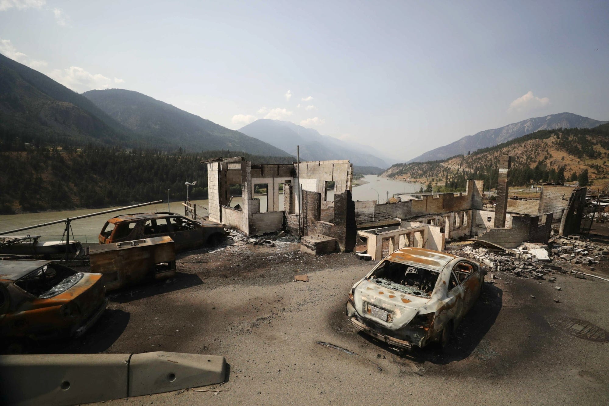 Damaged structures and vehicles are seen in Lytton, B.C., on Friday, July 9, 2021, after a wildfire destroyed most of the village on June 30. THE CANADIAN PRESS/Darryl Dyck