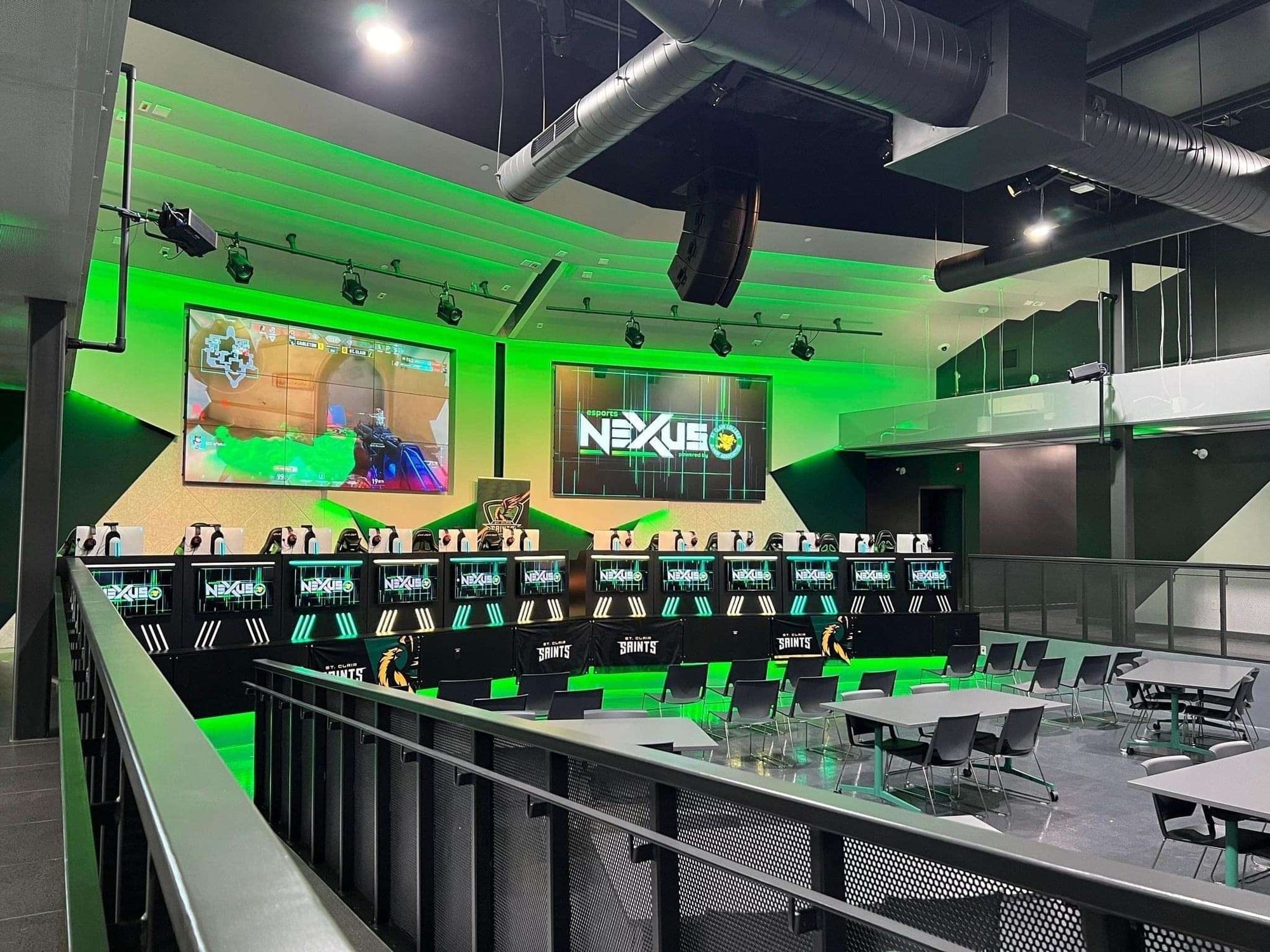 an e-sports arena lit with green lighting
