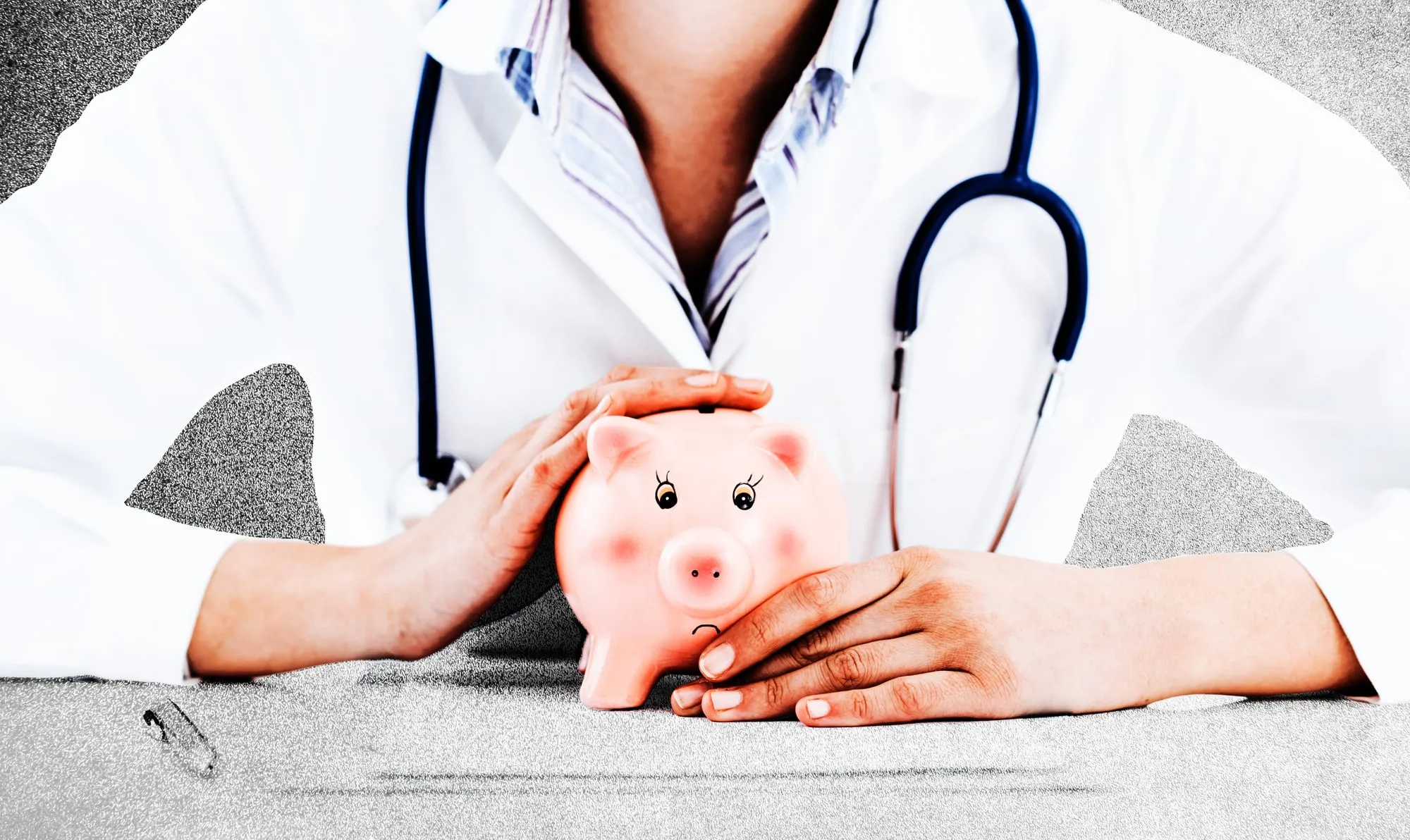 A person in a white coat holding a piggy bank