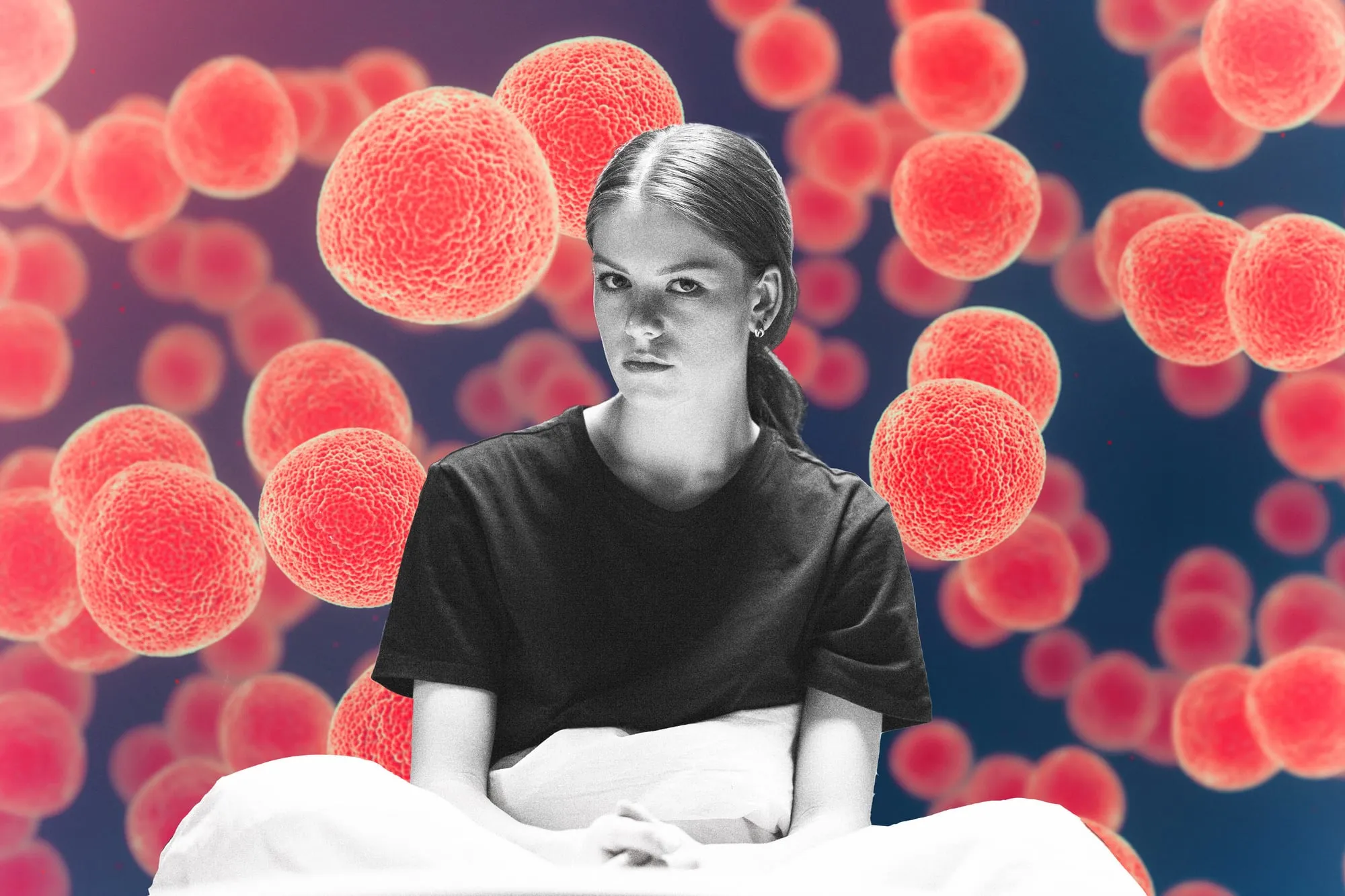 A woman in a t-shirt with cancer cells in the background
